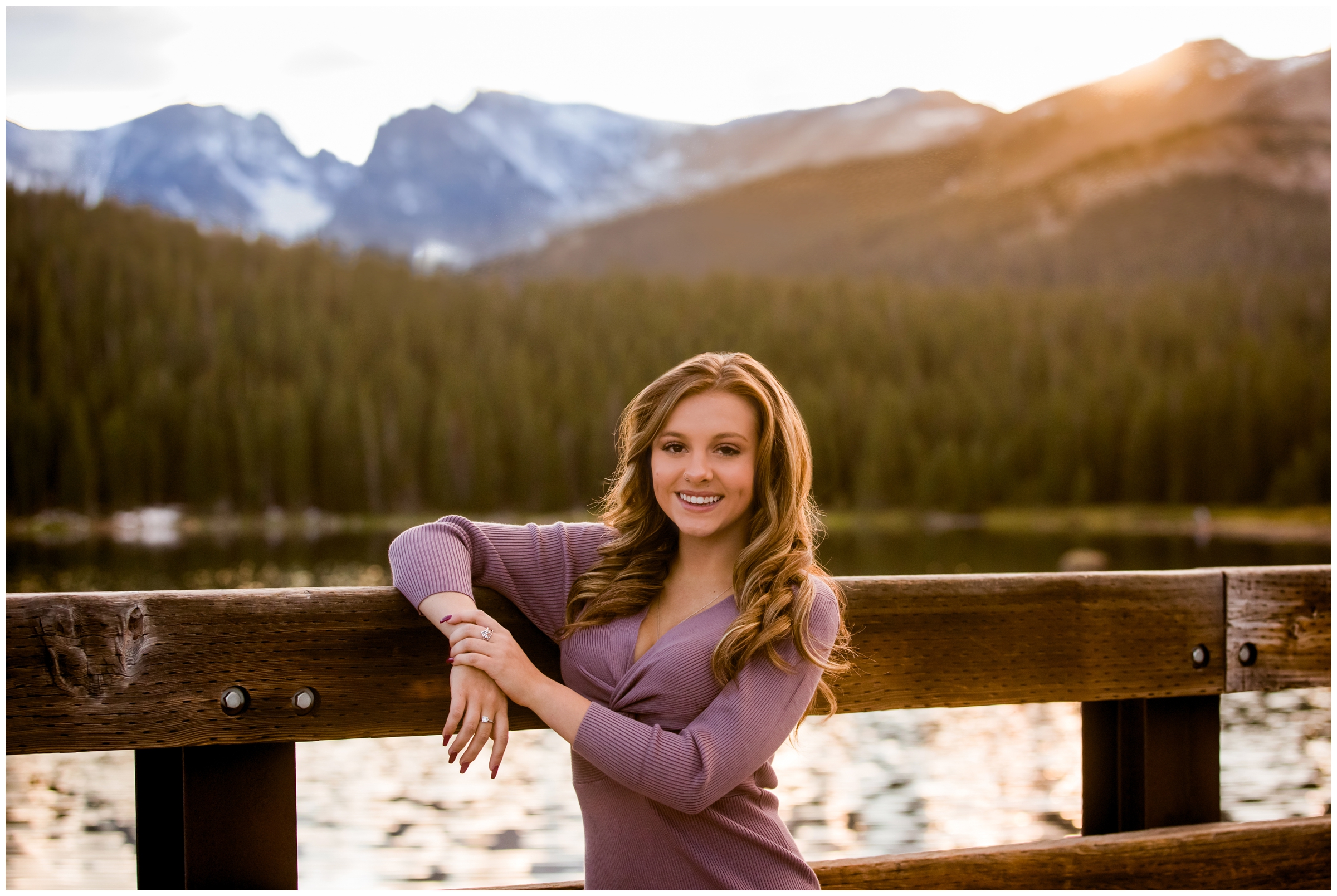 teen girl posing on bridge with mountains in background during Colorado senior portraits 