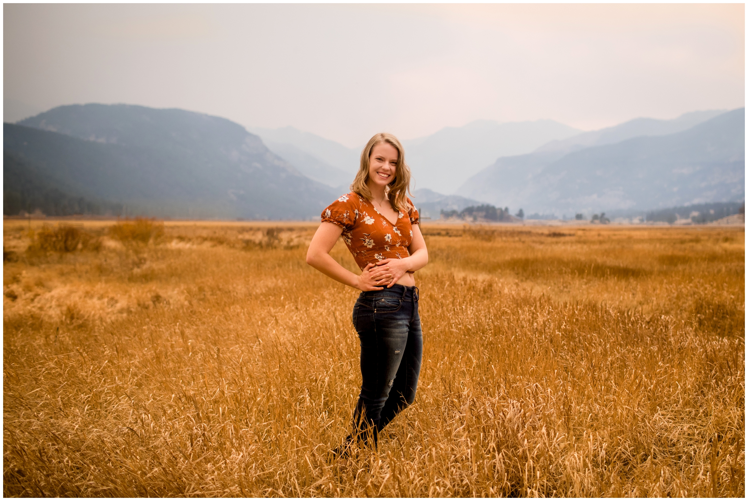 teen posing in a field during Estes Park senior pictures in RMNP 