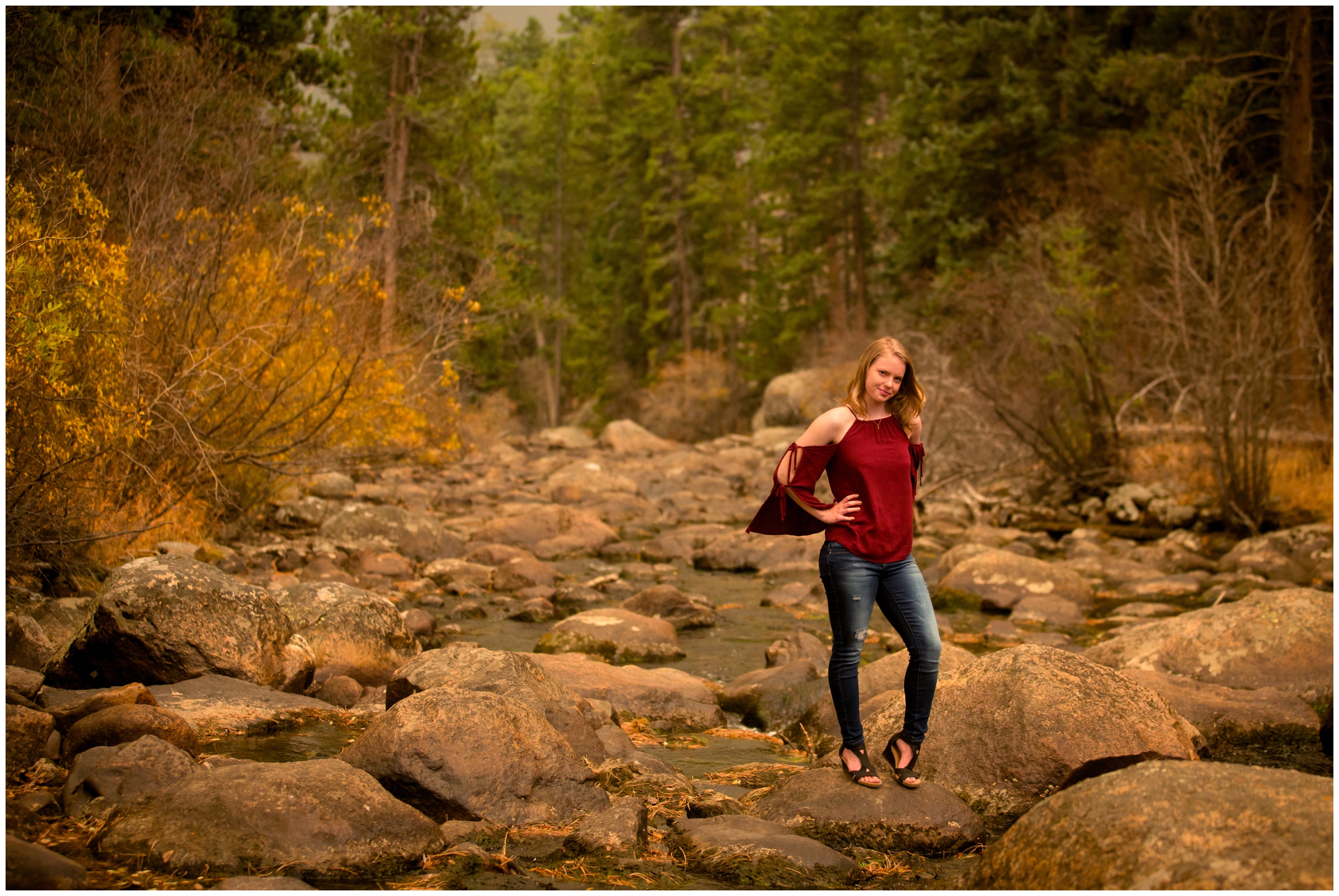 teen posing in river during Colorado mountain senior portraits 