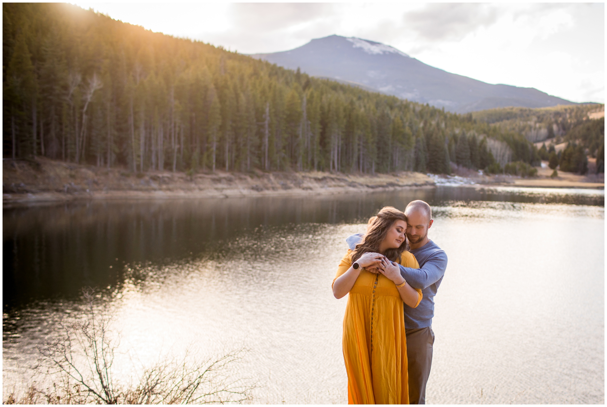 couple embracing during Evergreen Colorado engagement photography session 