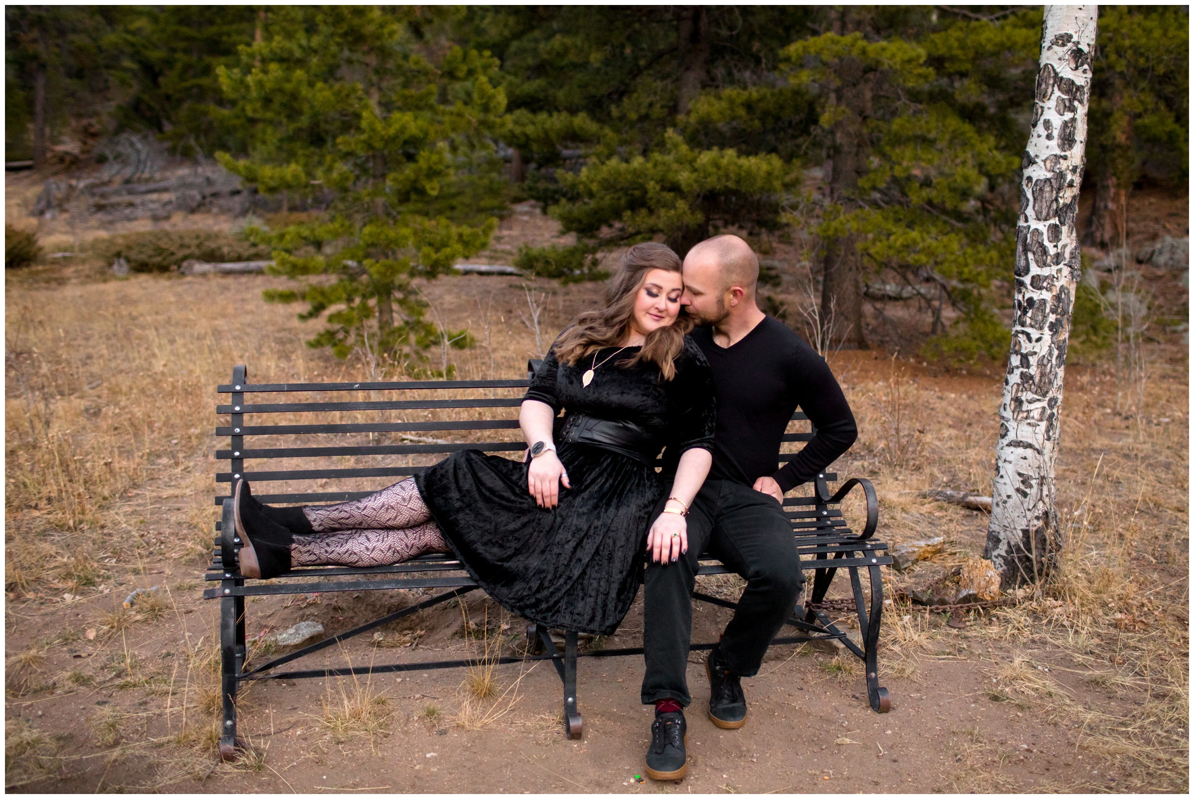 couple cuddling on bench during CO couple’s portraits at Frosberg Park 