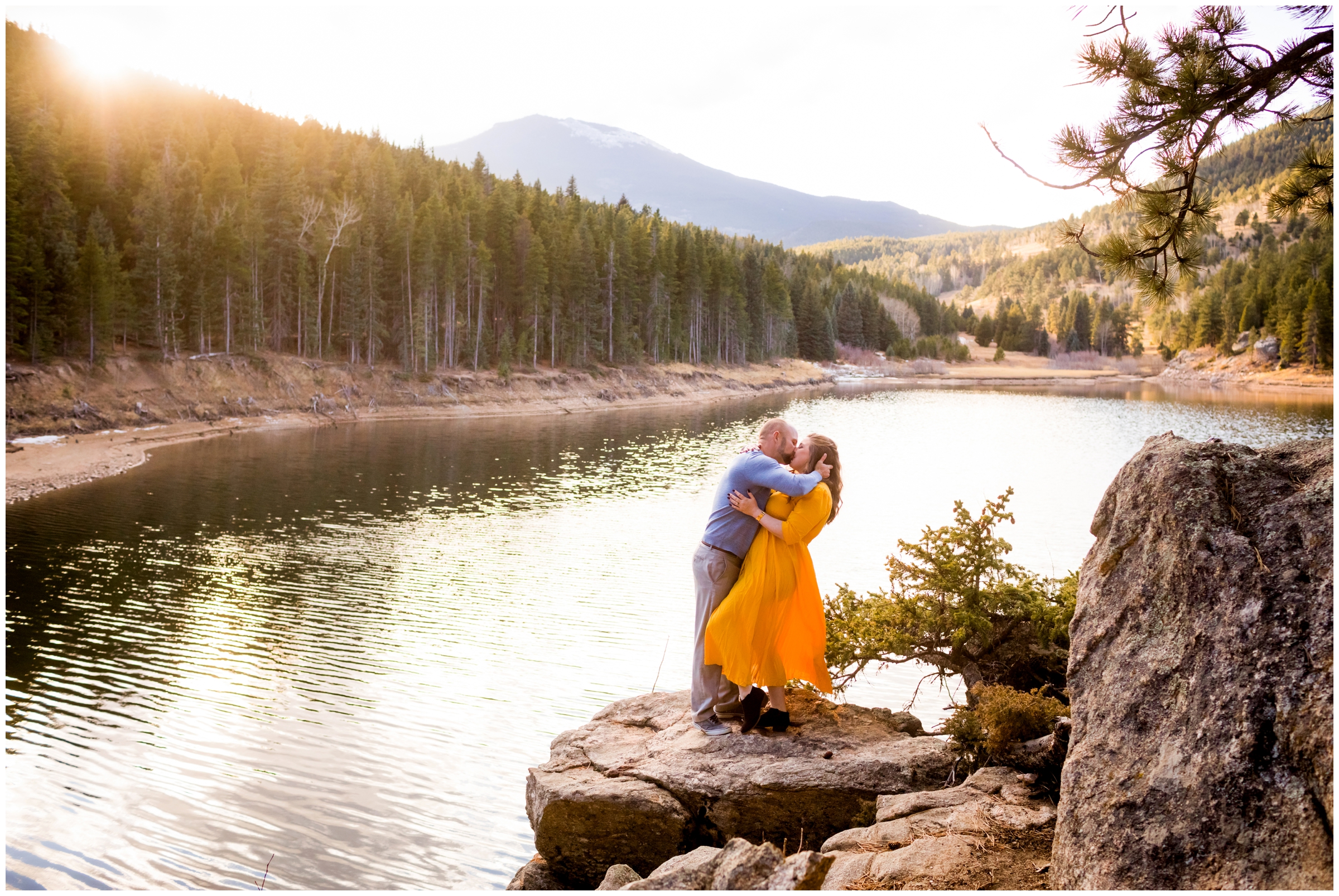 Couple kissing on a cliff during Colorado couple’s session in the mountains