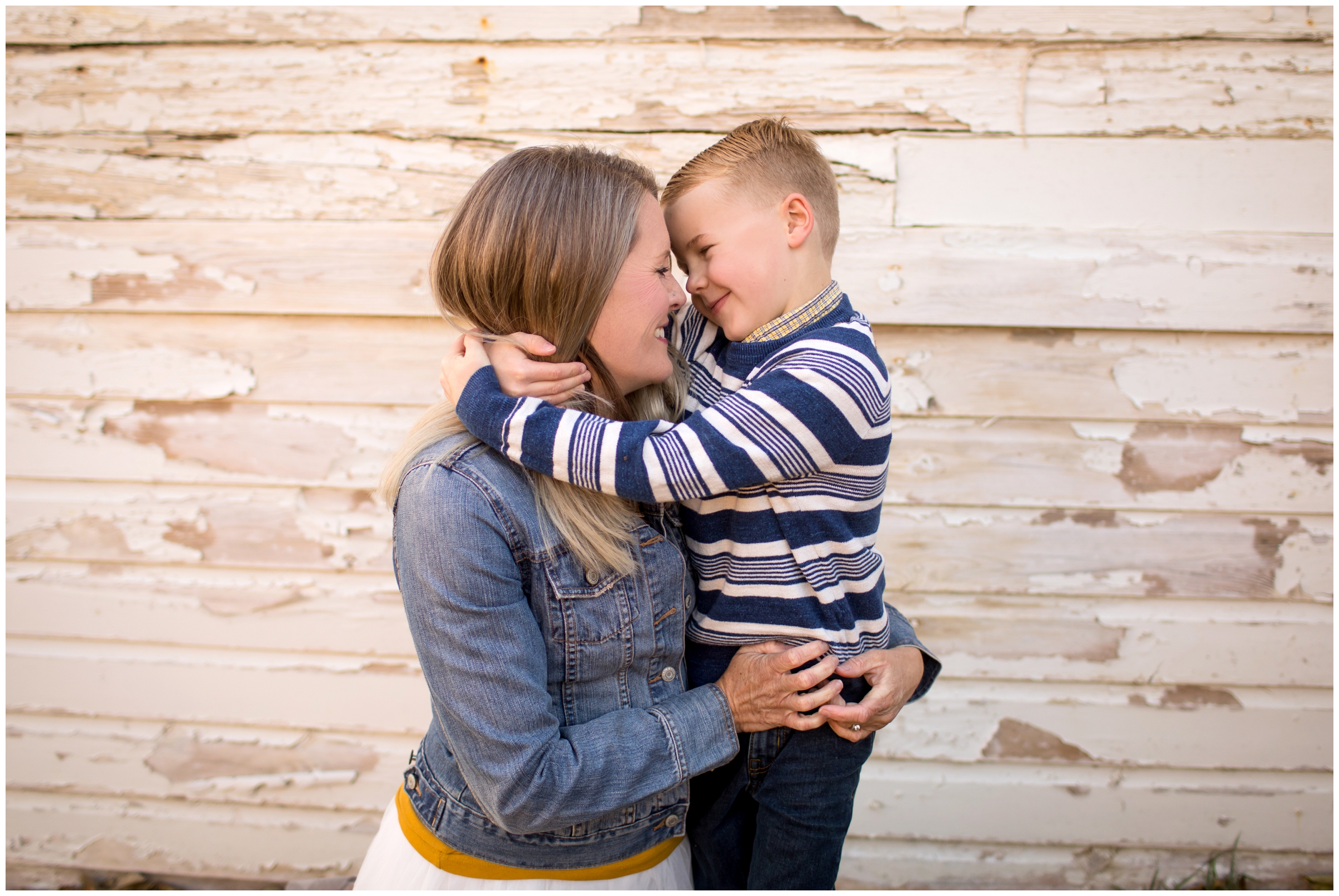 mom and son hugging during candid Colorado family photos 