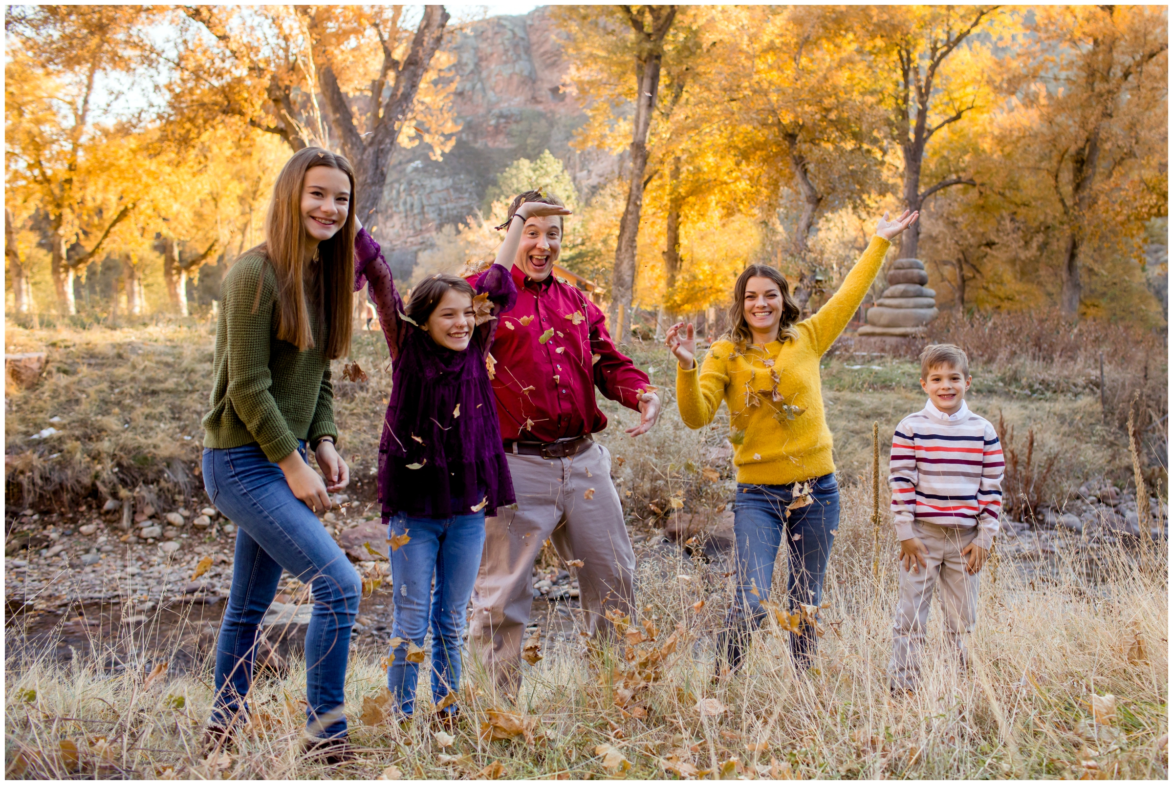 family throwing leaves at the Lavern M. Johnson Park in Colorado 