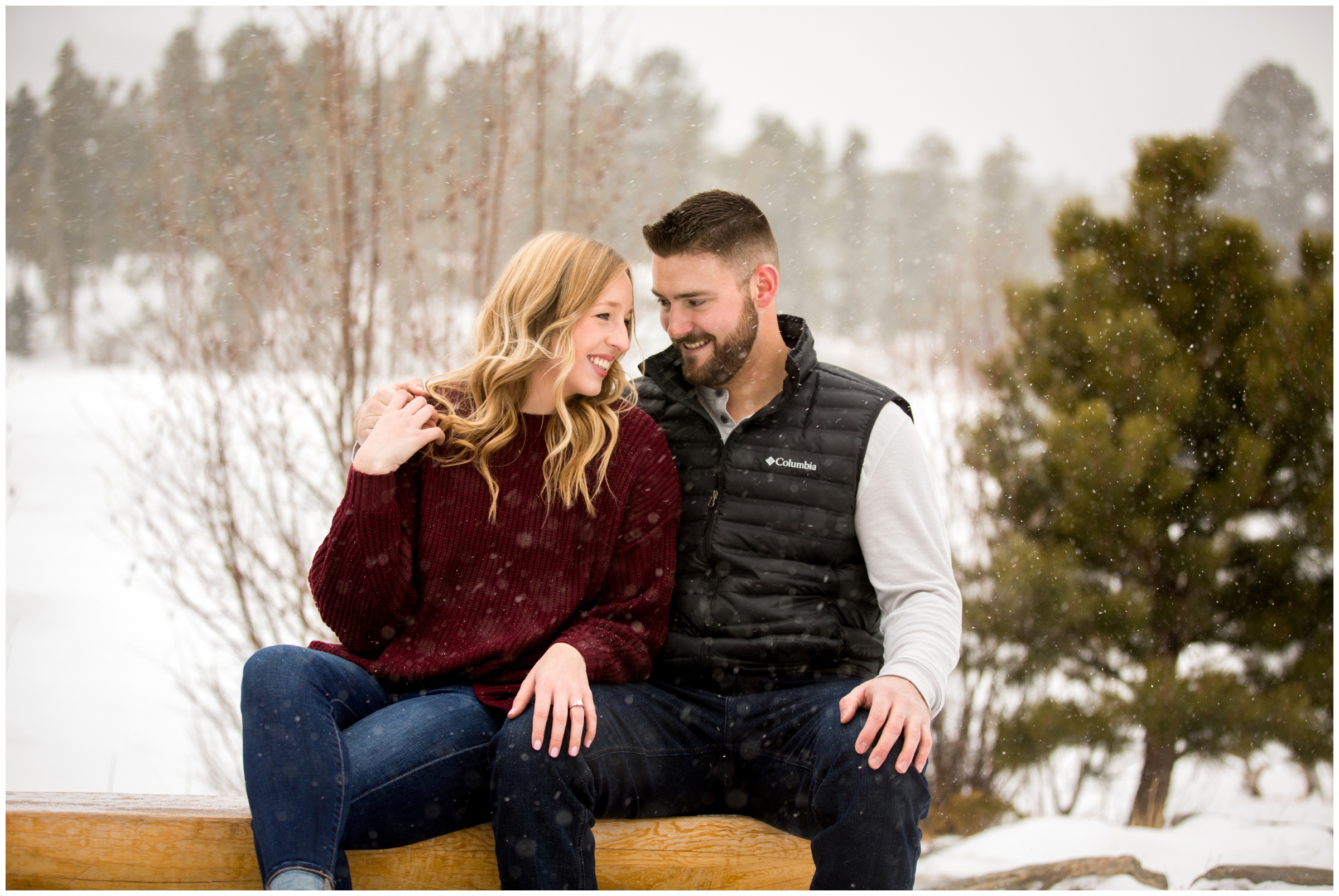 couple cuddling on bench during Estes park couple’s portraits in the snow 