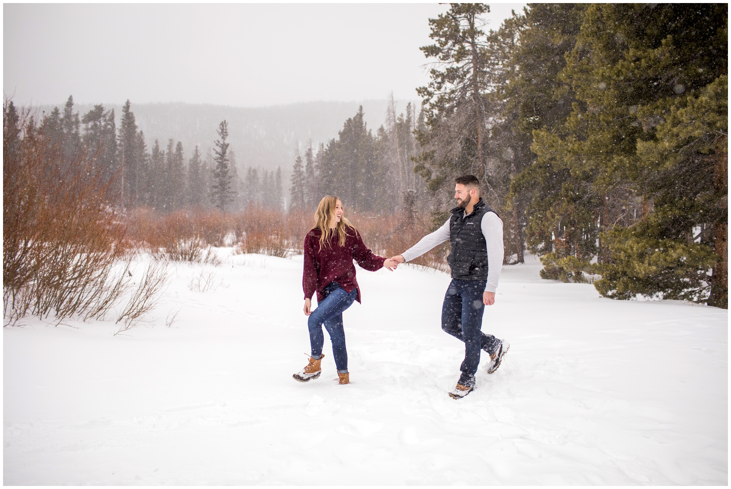 couple walking in the snow during couple’s portraits in Colorado mountains 