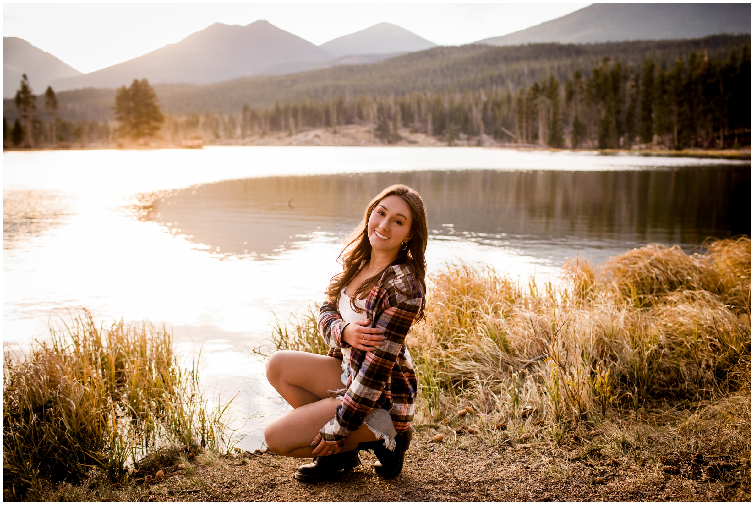 teen girl posing by mountain lake during Sprague Lake RMNP senior photos 