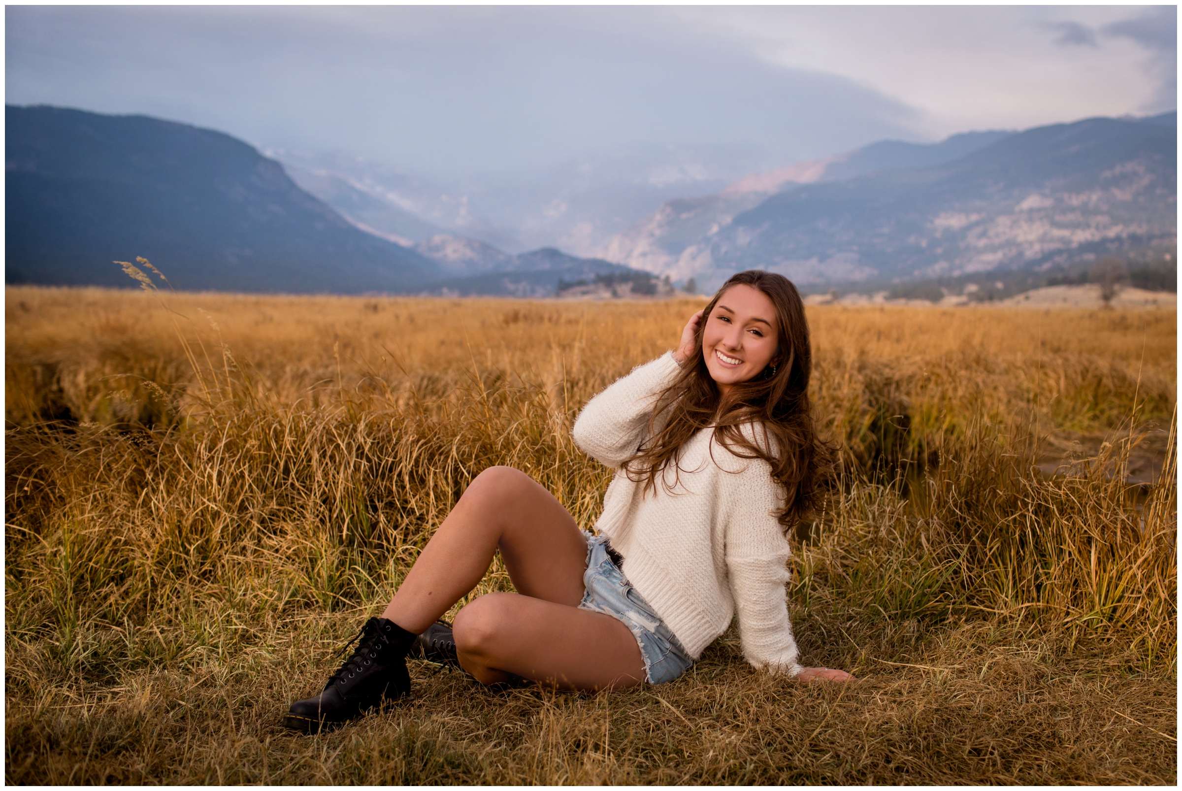 teen posing in field during Estes Park senior pictures in RMNP