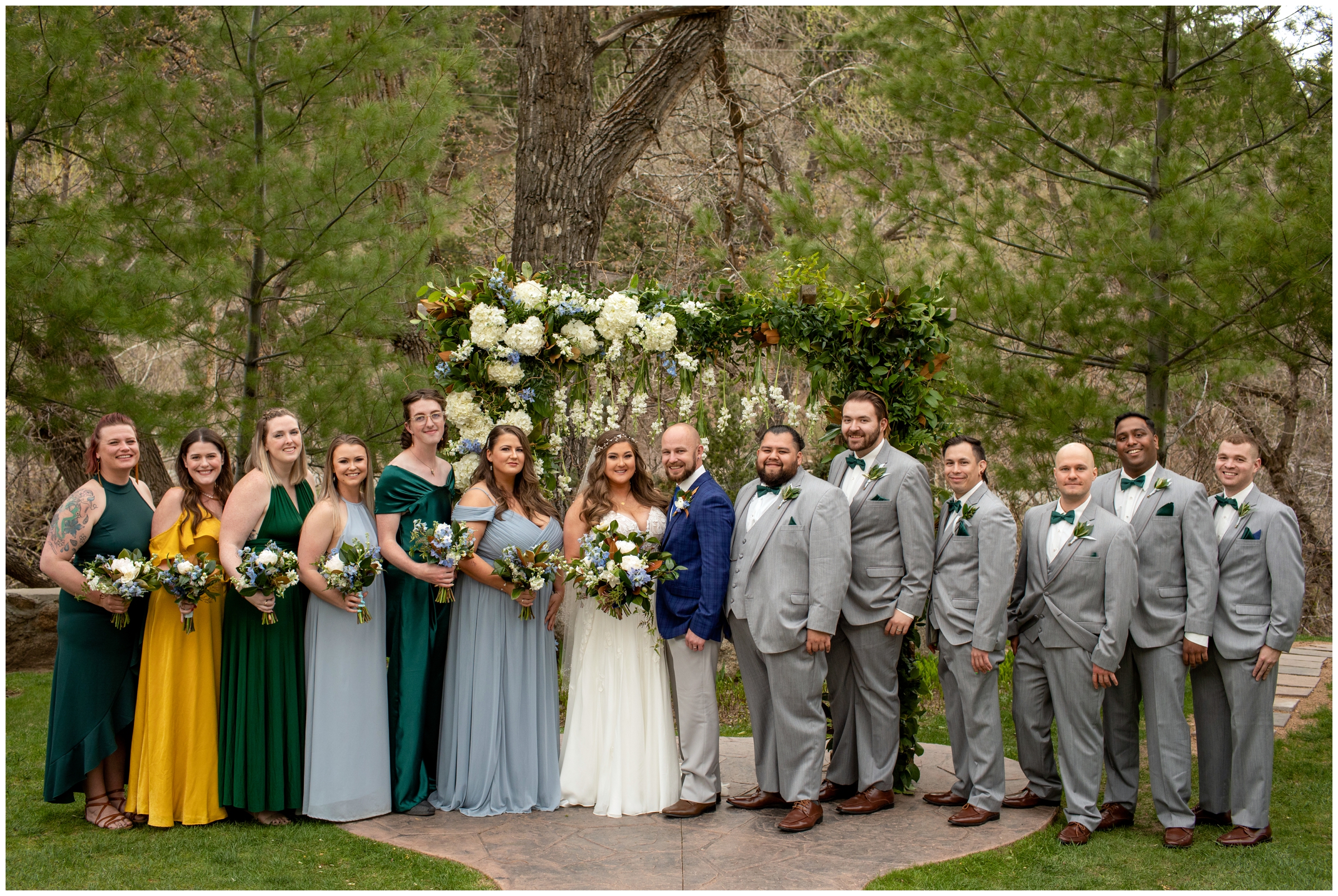 wedding party in green, light blue and yellow at Colorado springtime wedding 