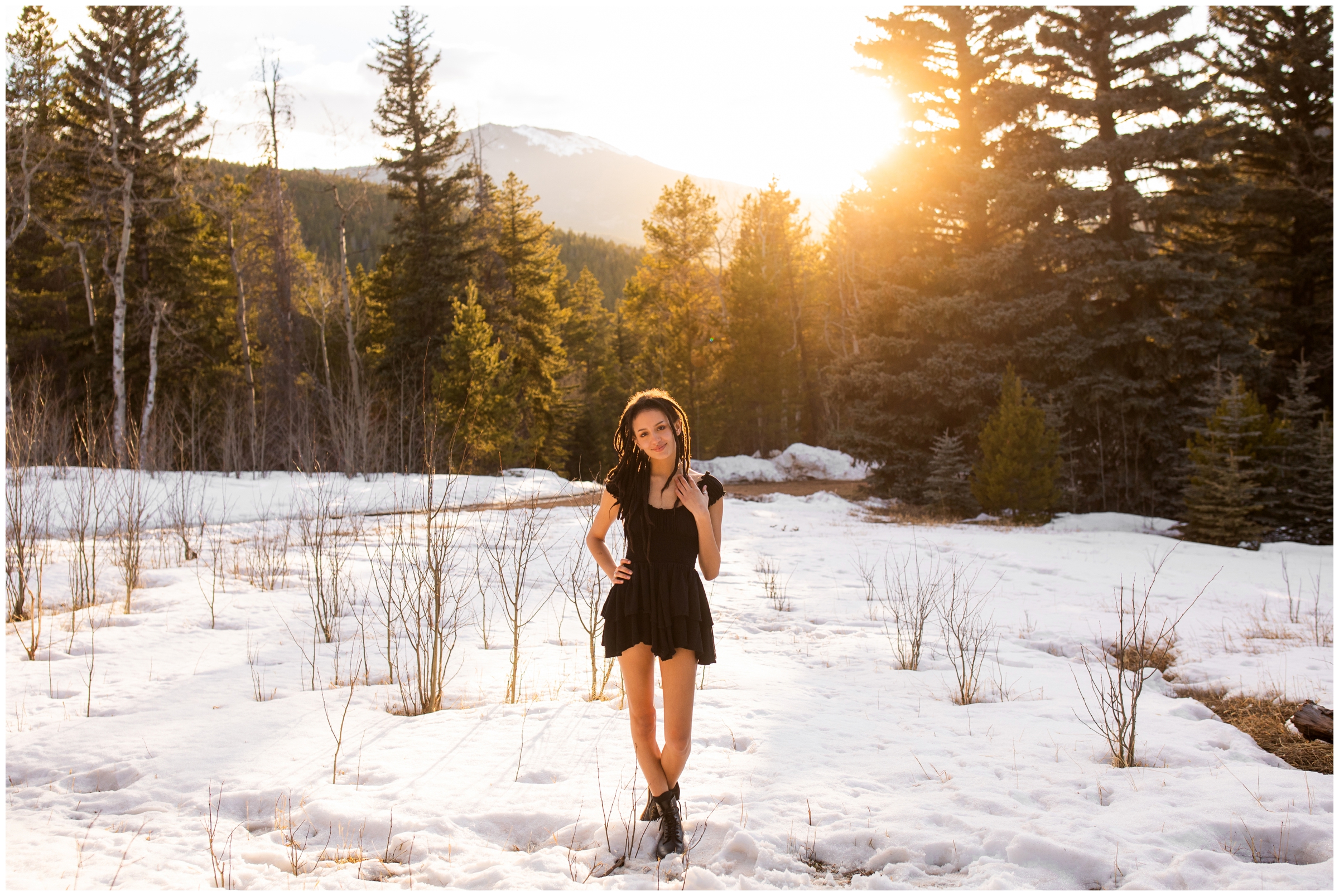 Teen posing in snow during Colorado mountain senior photos 