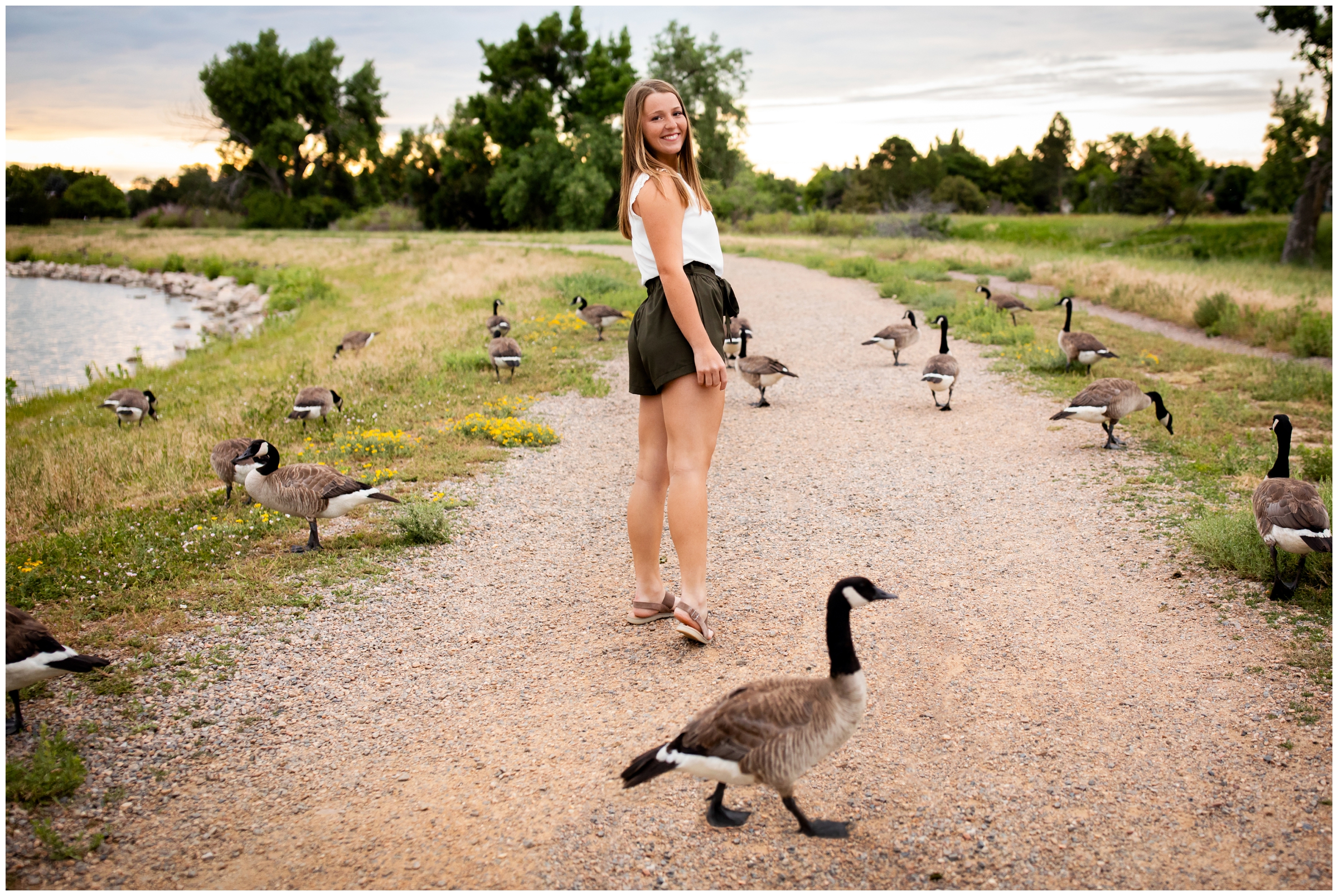 geese walking across the road during unique Colorado lake senior pictures in Louisville 