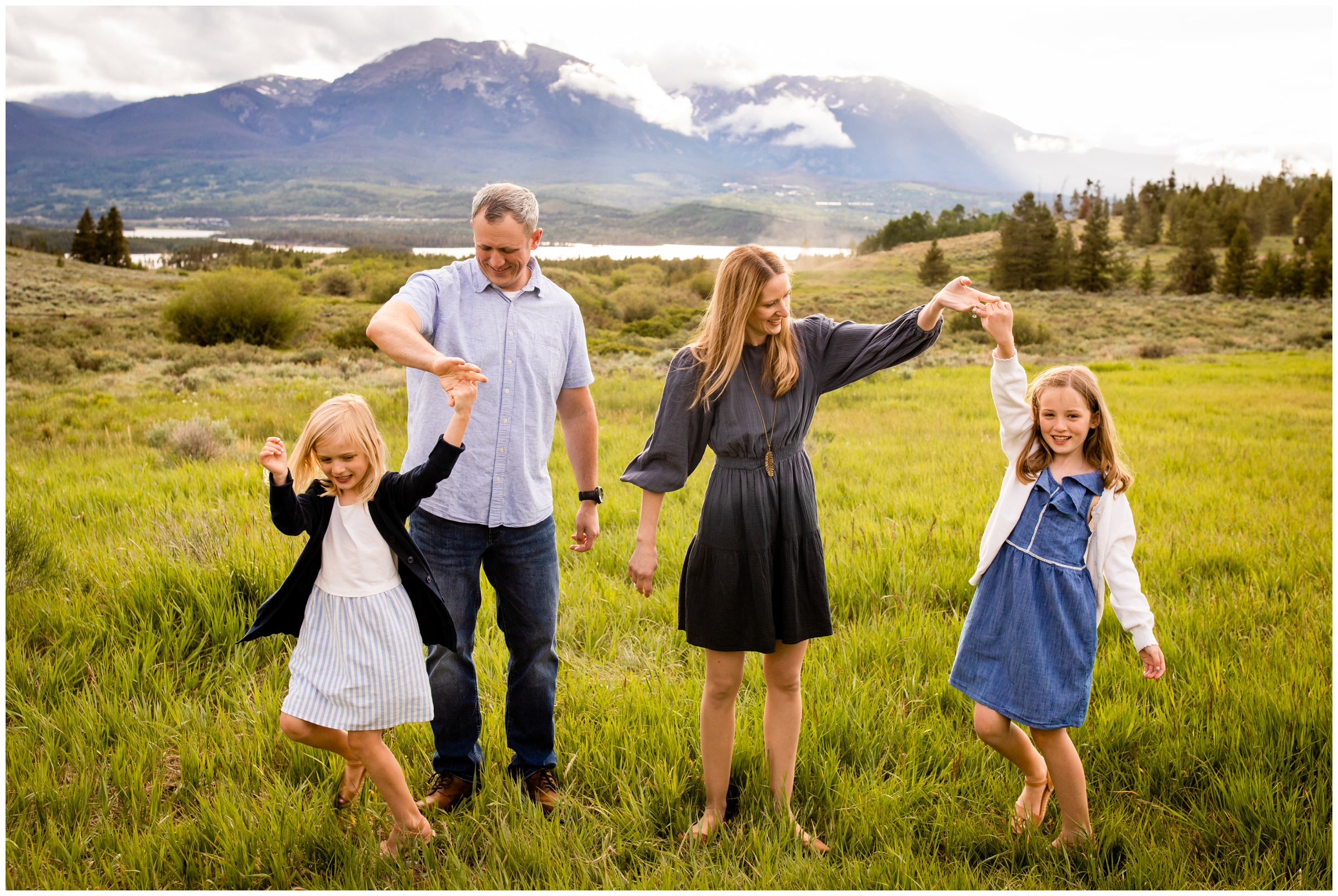 sweet candid family photos in a field in the Colorado mountains by Plum Pretty Photography 