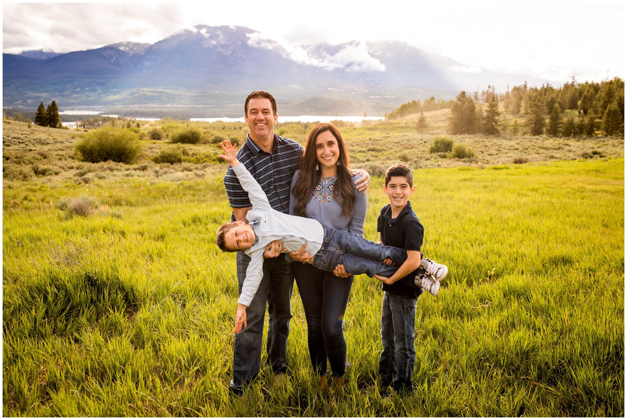 fun candid family photos in a field in the Colorado mountains by Plum Pretty Photography 
