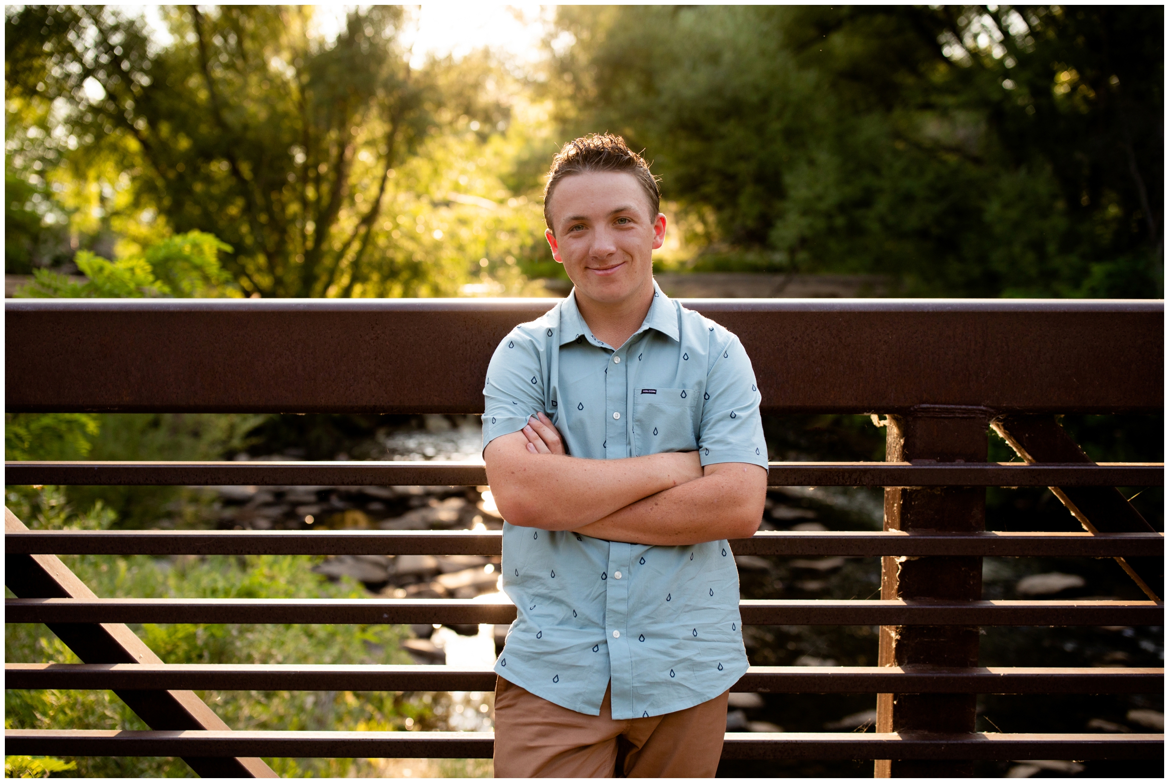 teen boy posing on bridge during Longmont Colorado nature senior pictures 