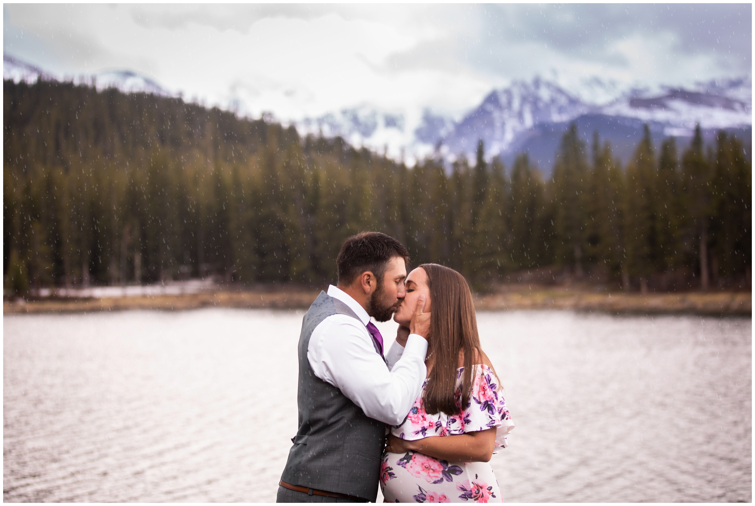 Couple kissing in the rain during Colorado mountain maternity photography session in Idaho springs 