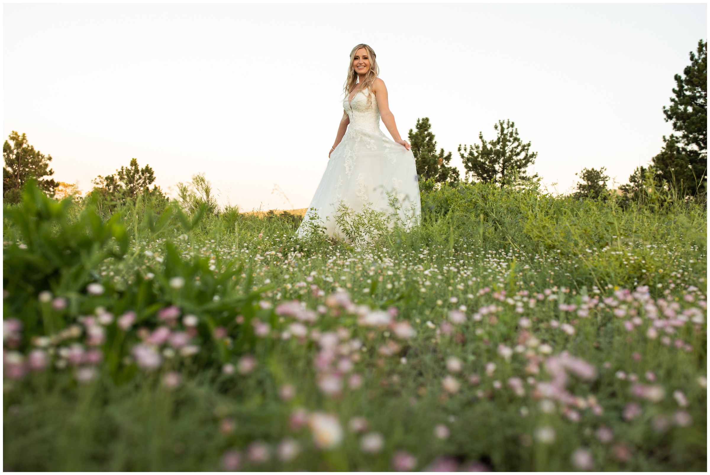 Colorado bride in a field of wildflowers at Lionscrest Manor in the CO mountains