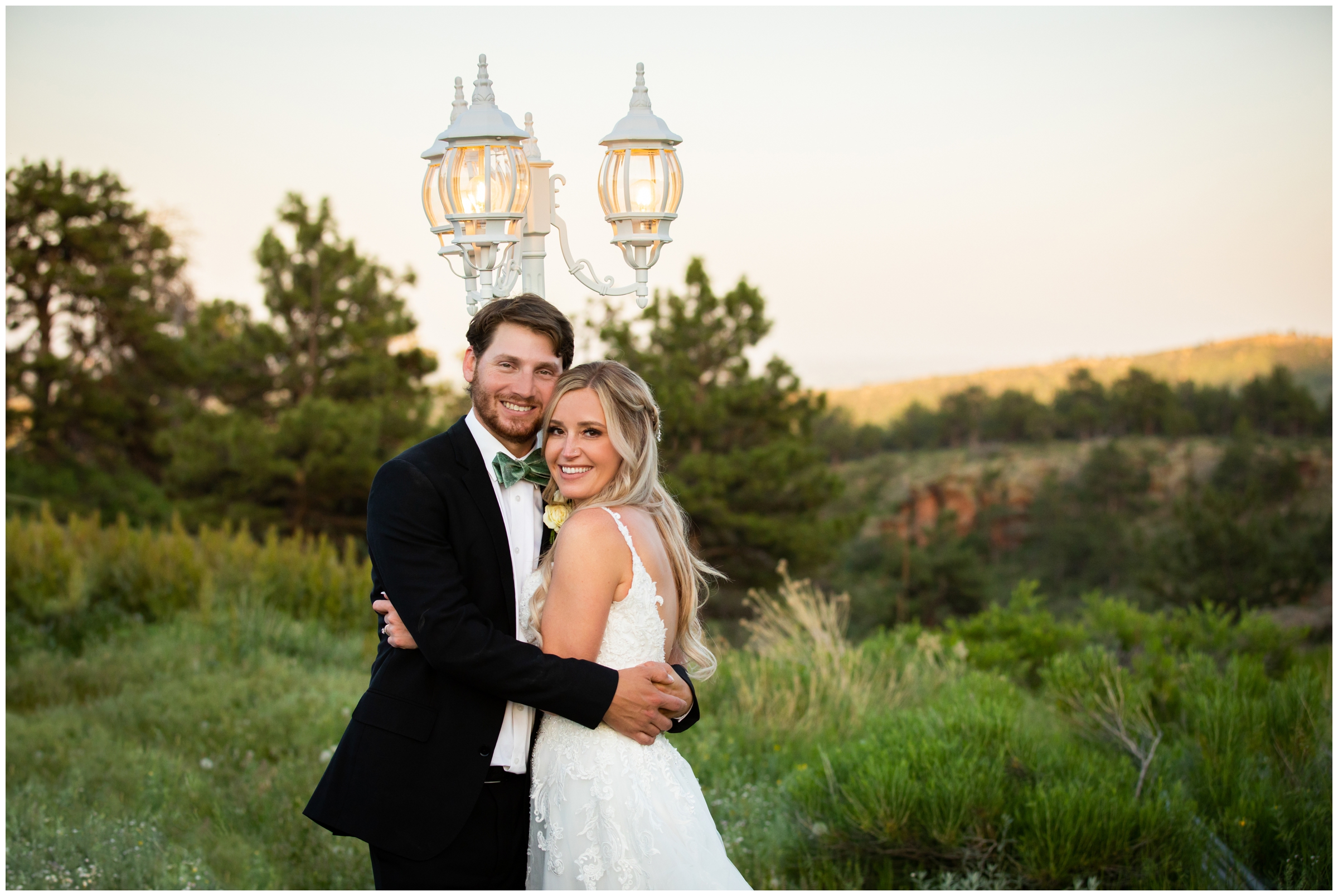 couple posing in front of lamp post during Lionscrest Manor Colorado mountain wedding photos 