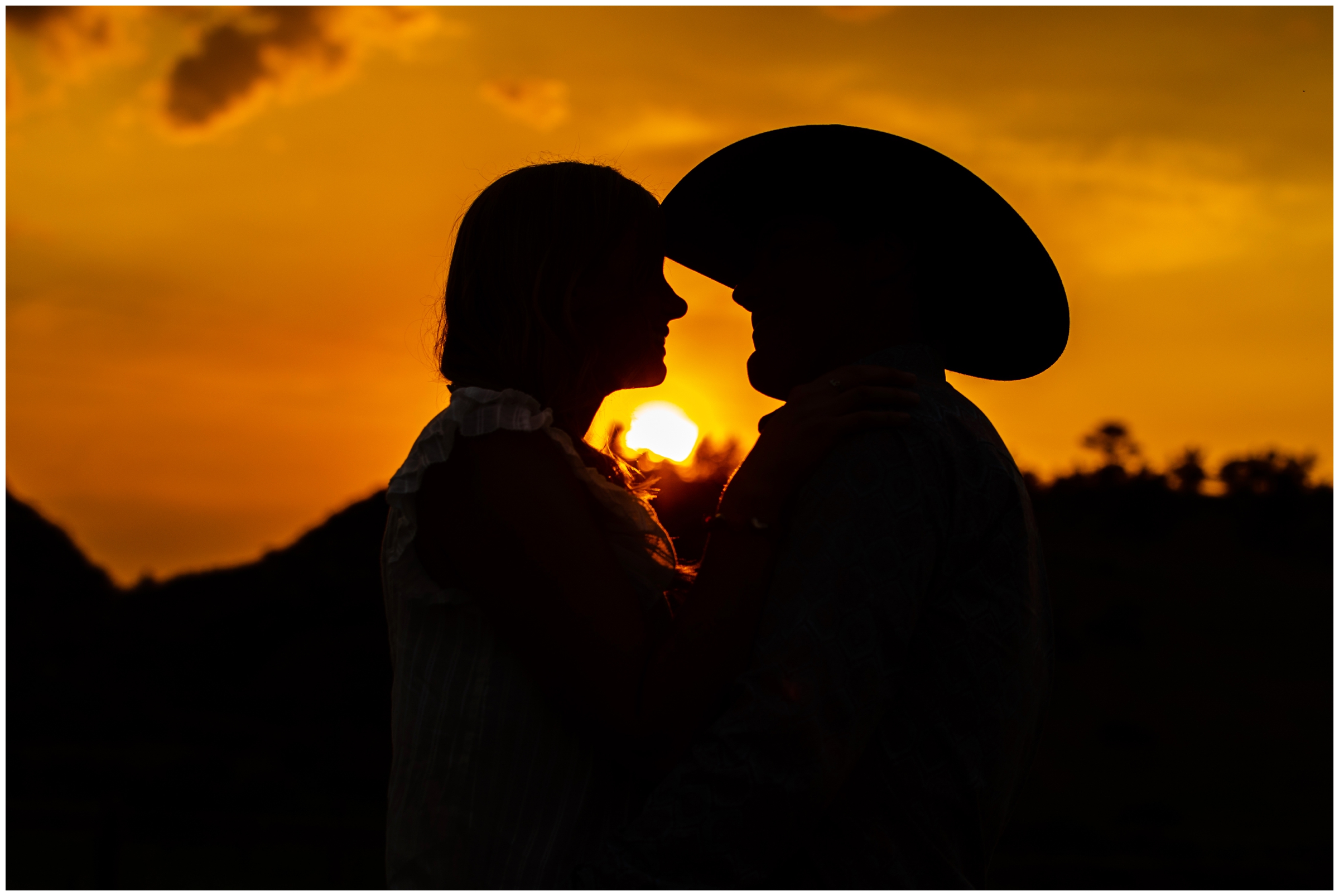 Silhouette photo of man and woman at sunset during Loveland engagement photos 