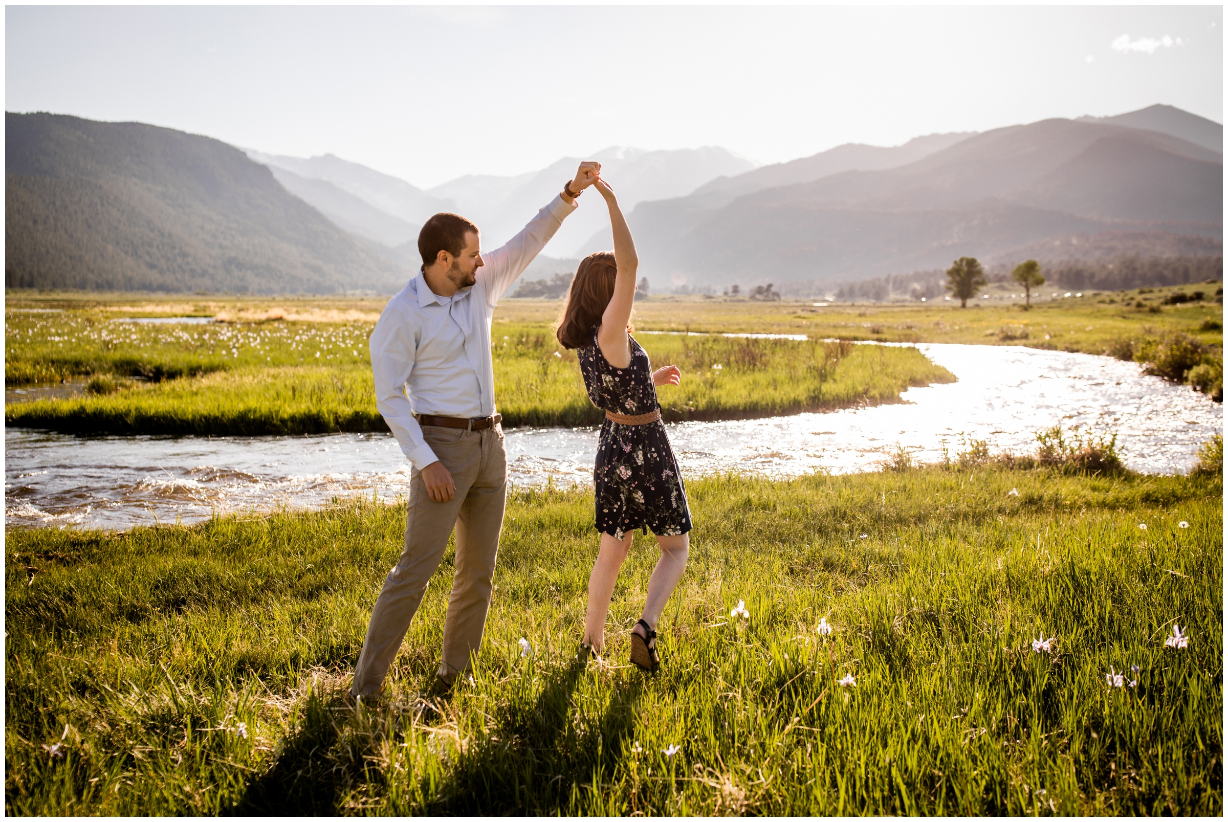 couple dancing near the river at Moraine Park in RMNP during estes Park engagement photos 