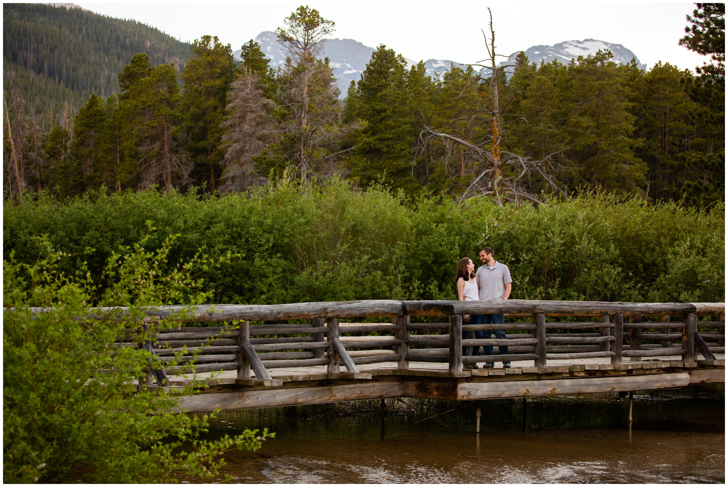 couple posing on bridge at Sprague Lake in Estes Park Colorado 