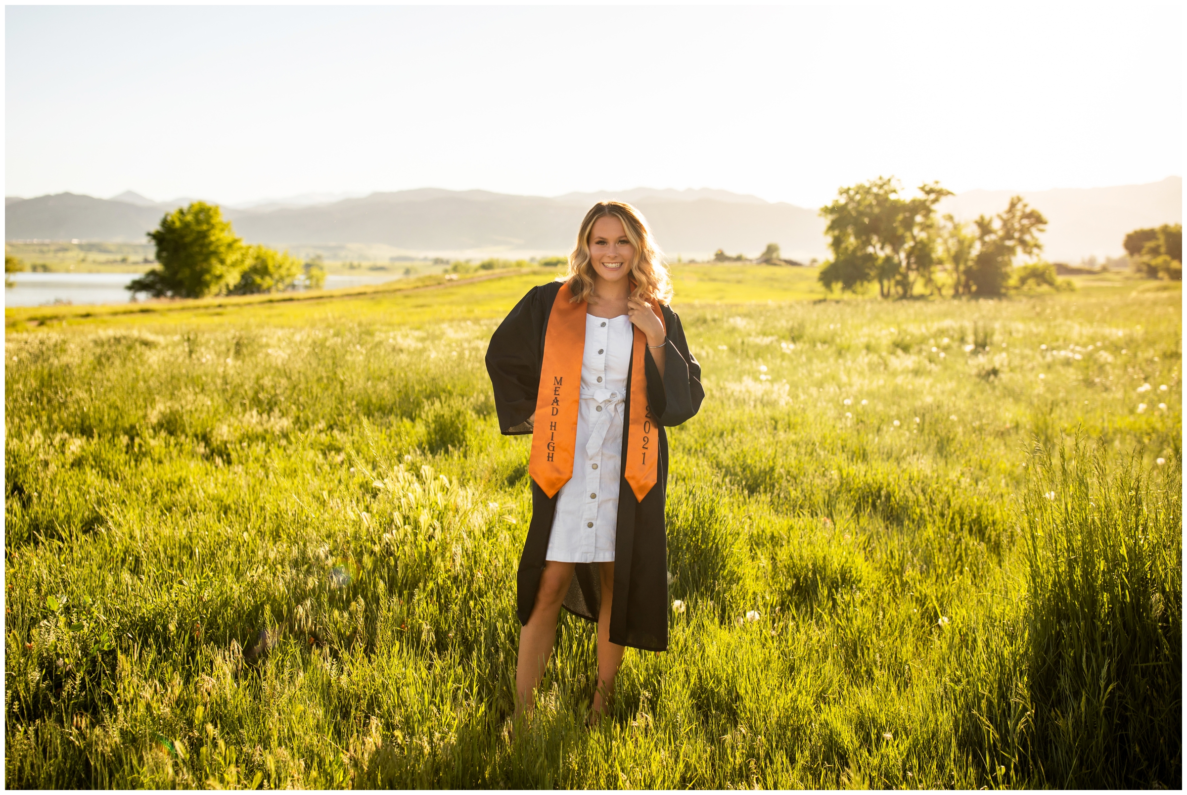 teen girl posing in graduation robe during boulder Colorado cap and gown photography session at coot lake 