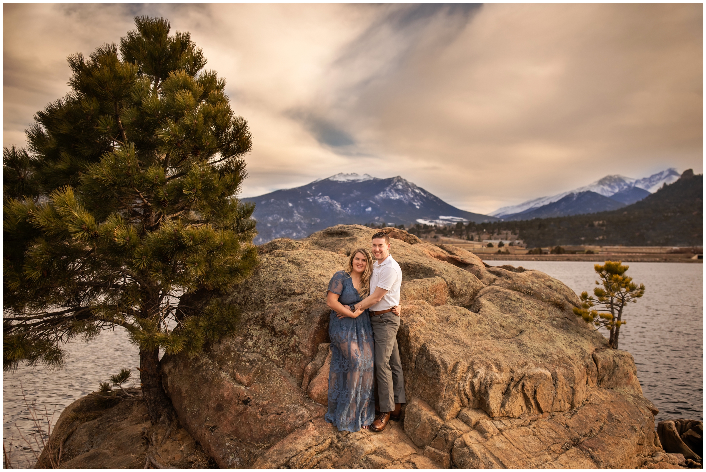 couple posing on a rock during Colorado mountain engagement portraits 