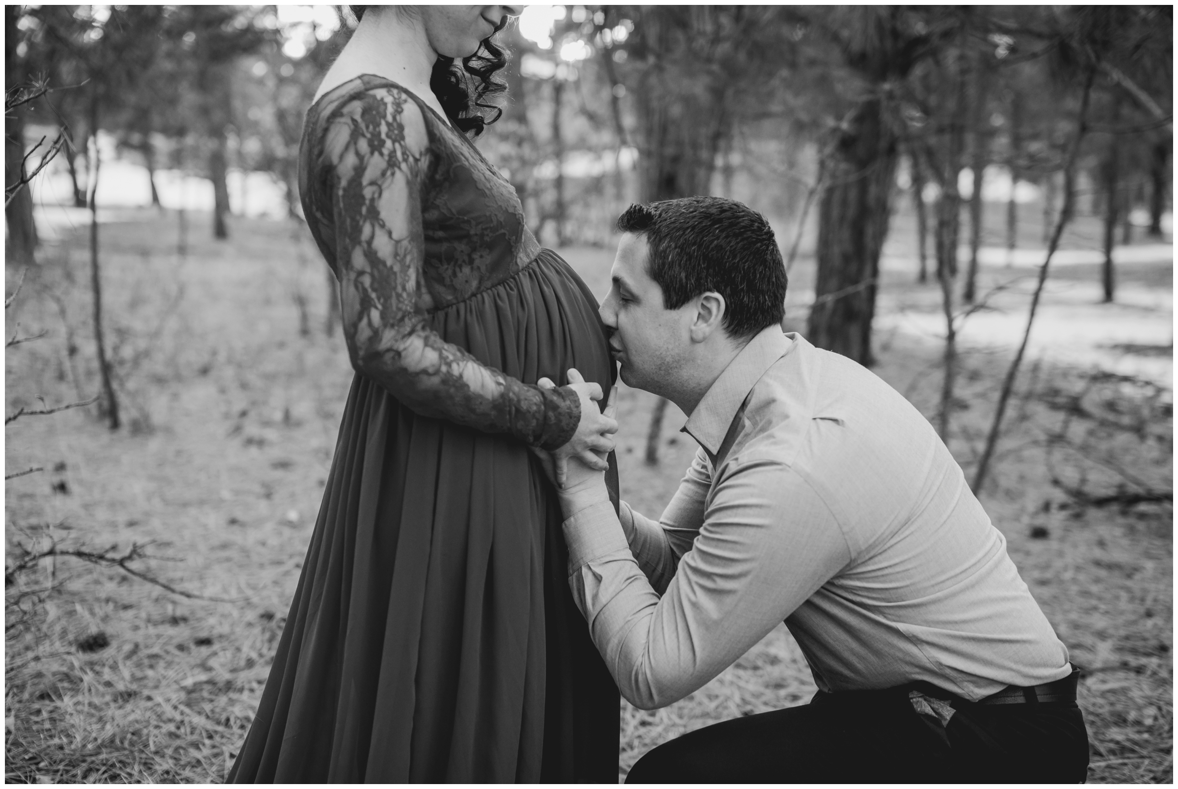 guy kissing his pregnant wife's belly during Colorado pregnancy photo session 