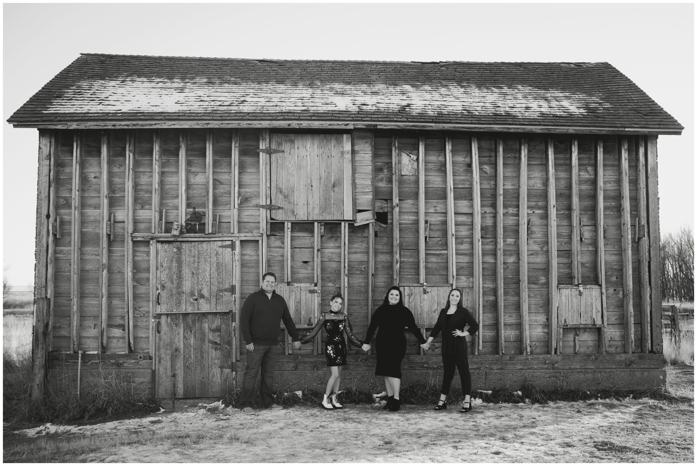 rustic family photography inspiration in front of a huge barn in Longmont 