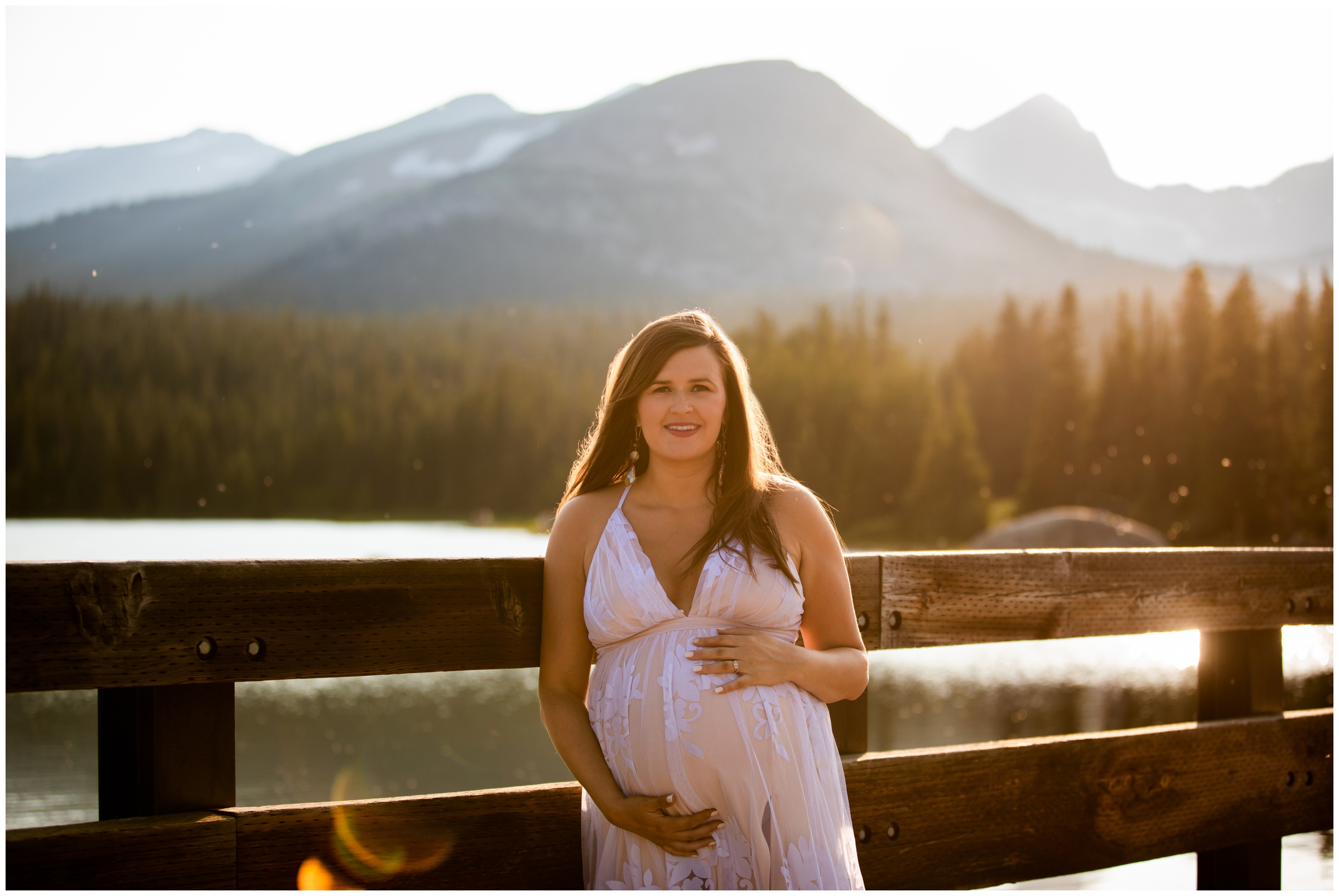 woman posing on bridge during Colorado mountain lake maternity pictures 