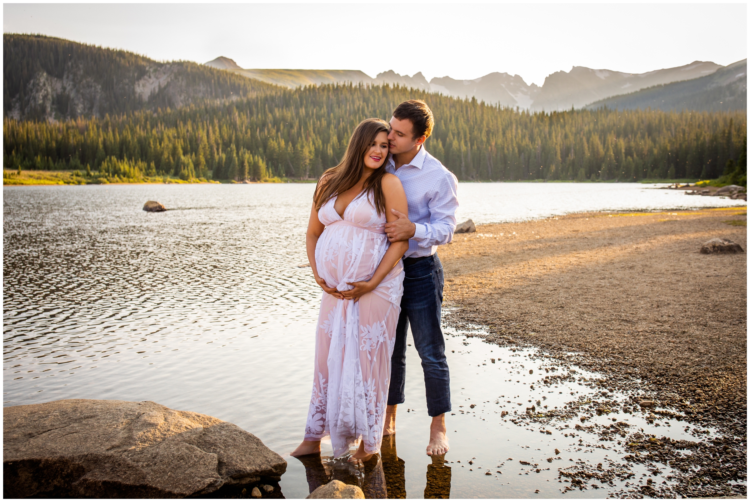Couple standing in lake during Colorado maternity photos at Brainard Lake 