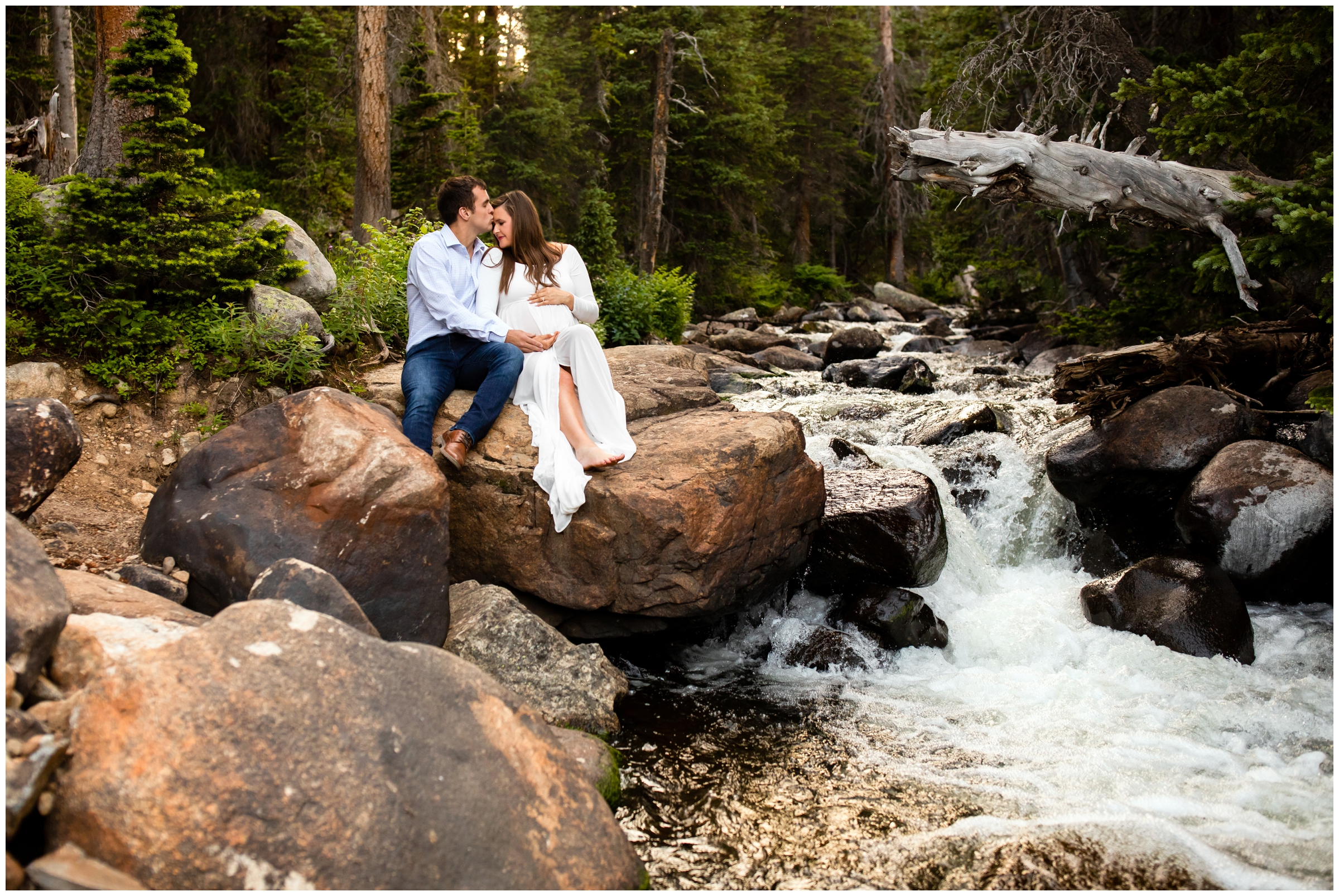 Couple sitting on large boulder during Brainard lake Colorado mountain maternity photo session 