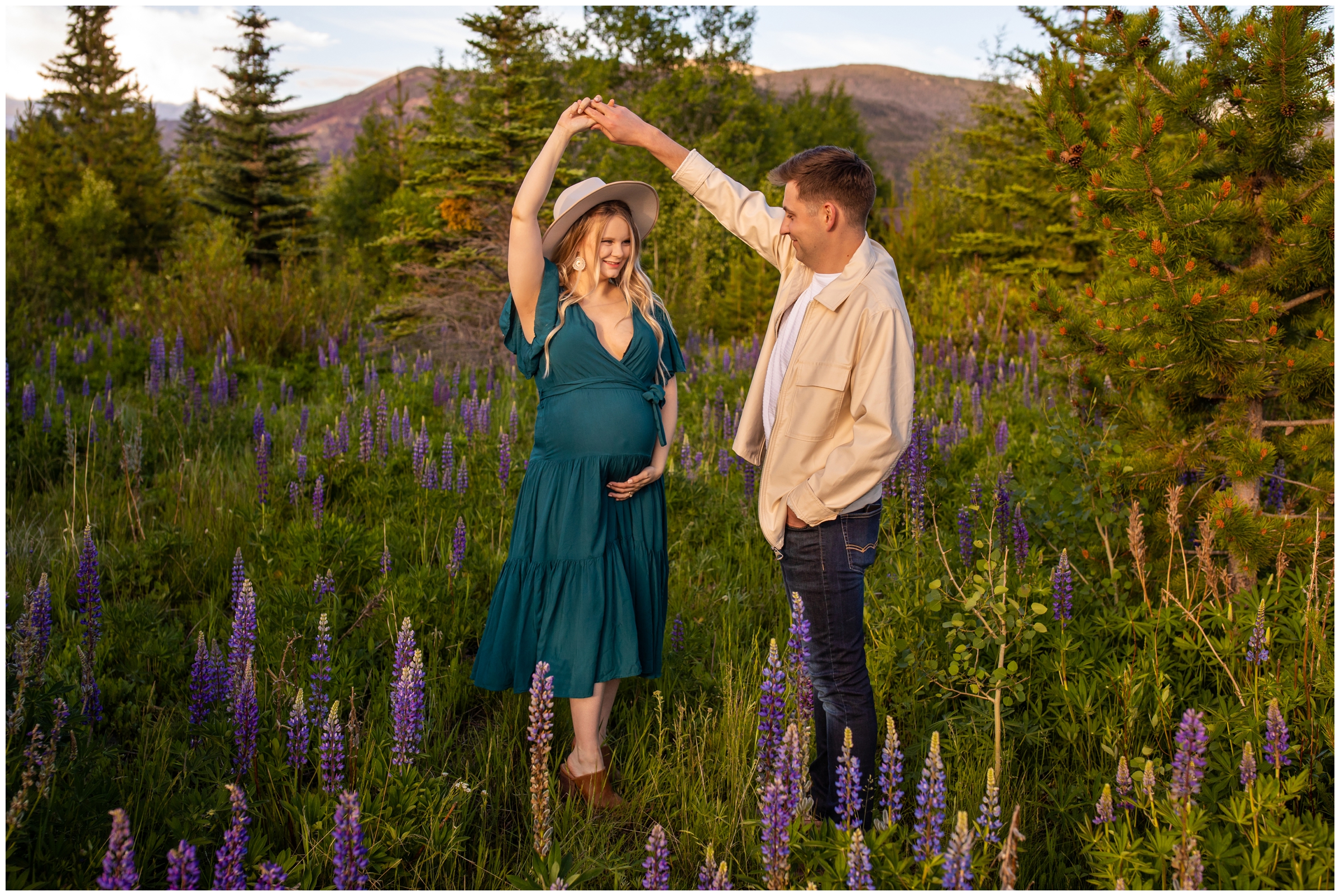 couple dancing in a wildflower field during Colorado mountain couples photography session 