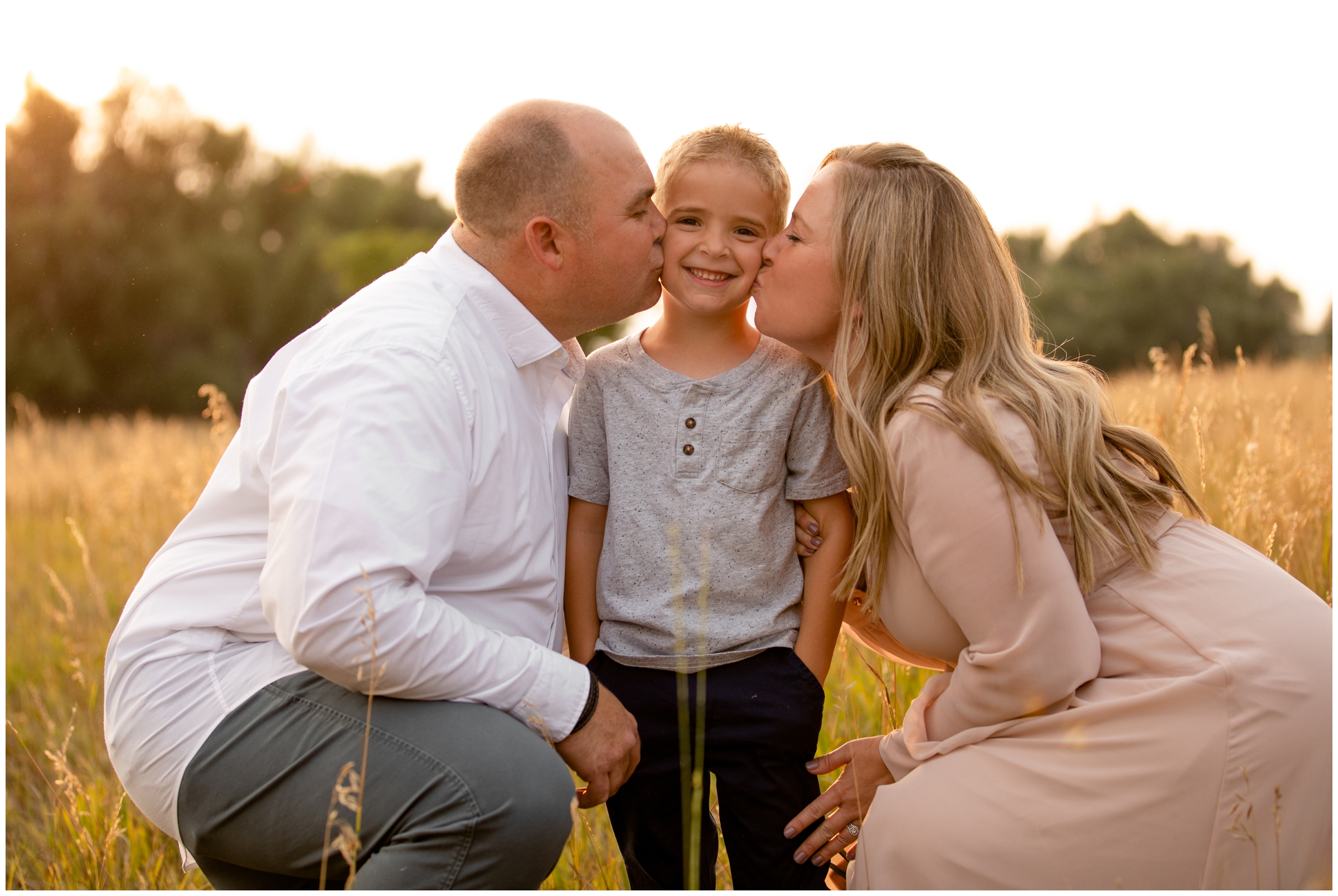 parents kissing son's cheeks during rustic family photography session in Longmont Colorado 