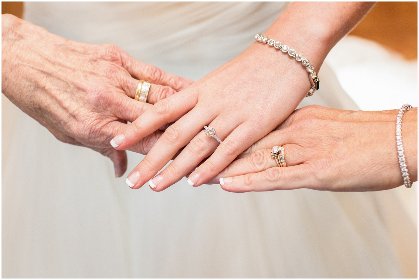 picture of bride, mother, and grandmother's hands