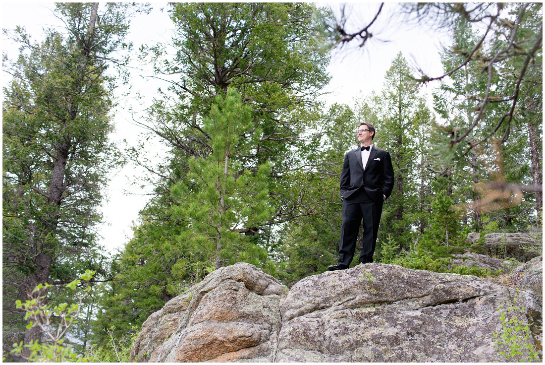 photo of groom on a cliff