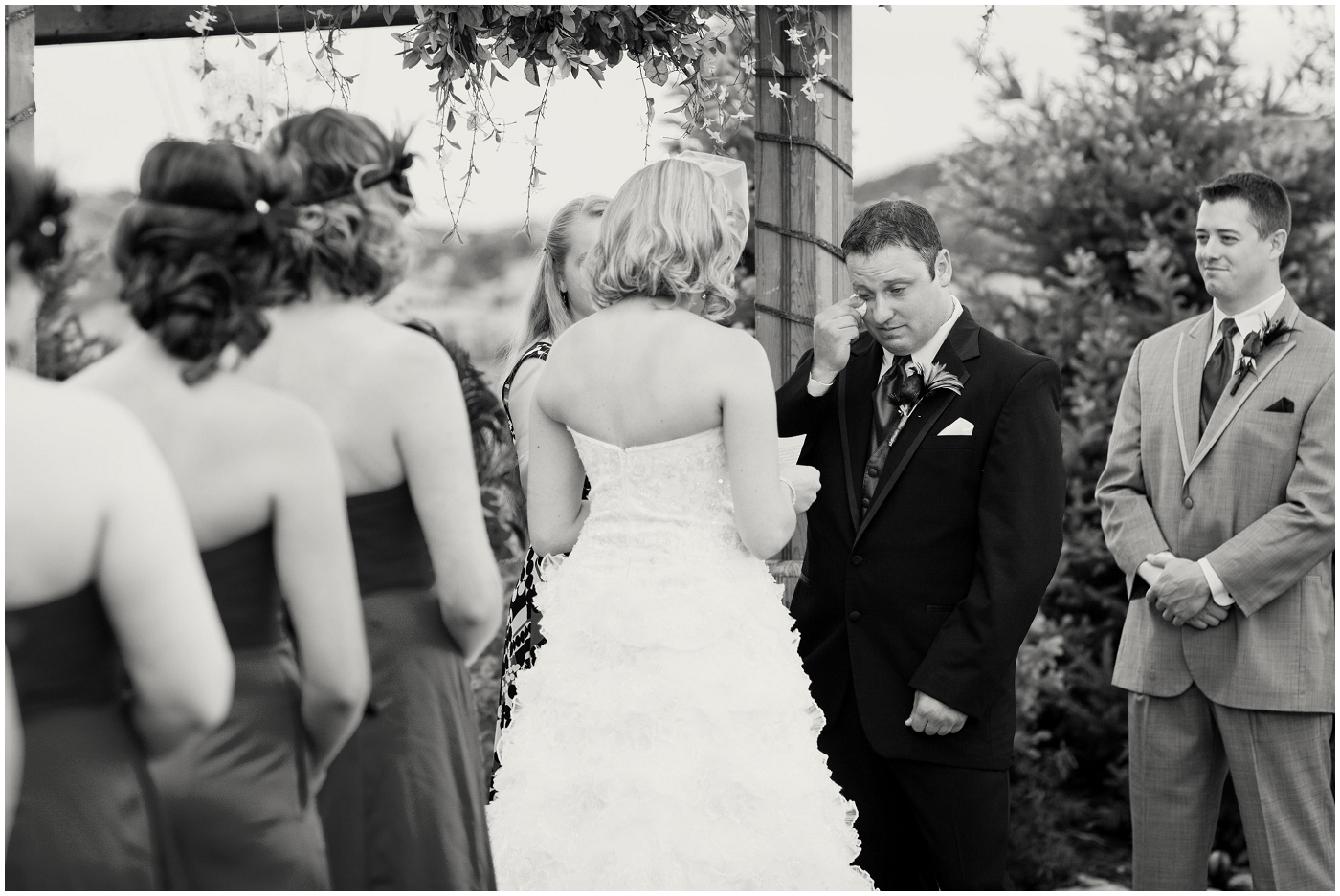 picture of groom wiping a tear