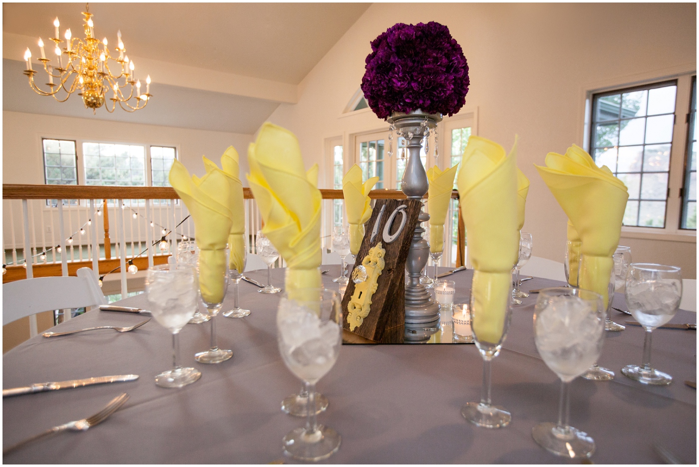 picture of purple centerpiece at lionscrest manor wedding