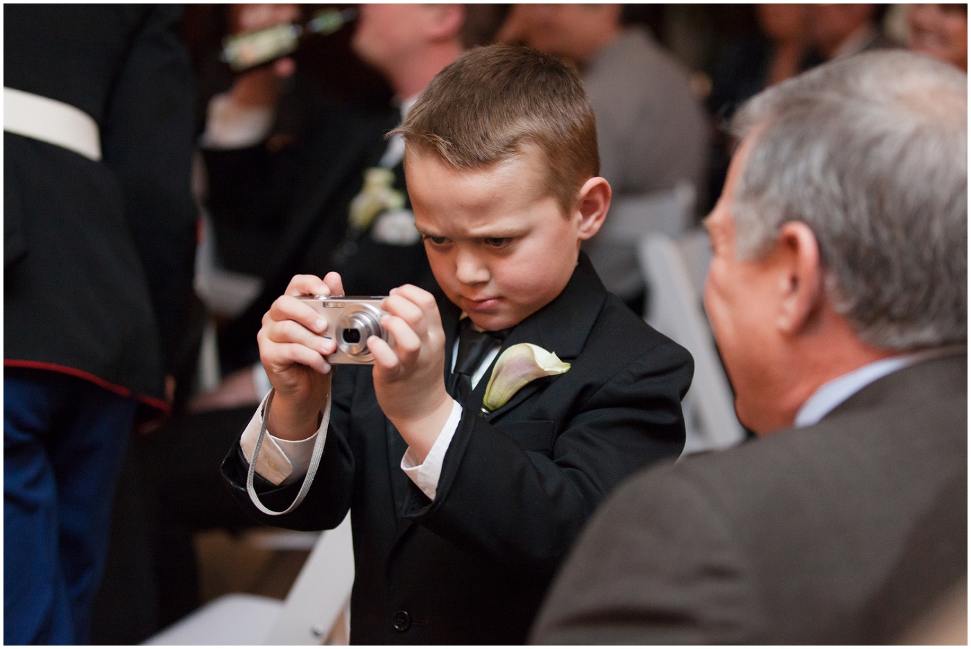 picture of ring bearer holding camera
