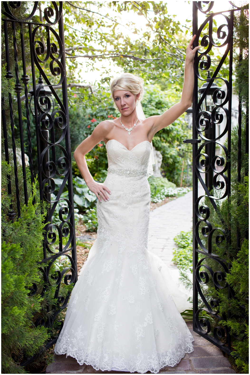picture of bride with wrought iron gate