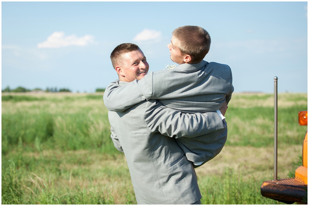 picture of groom carrying groomsman