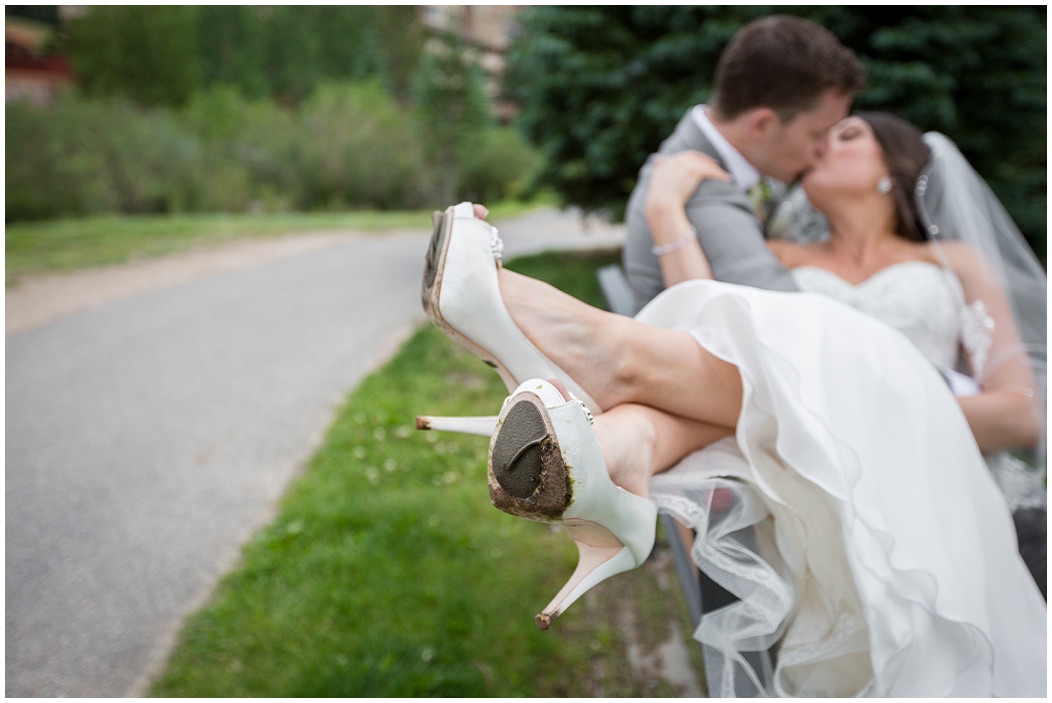 picture of bride and groom on a bench