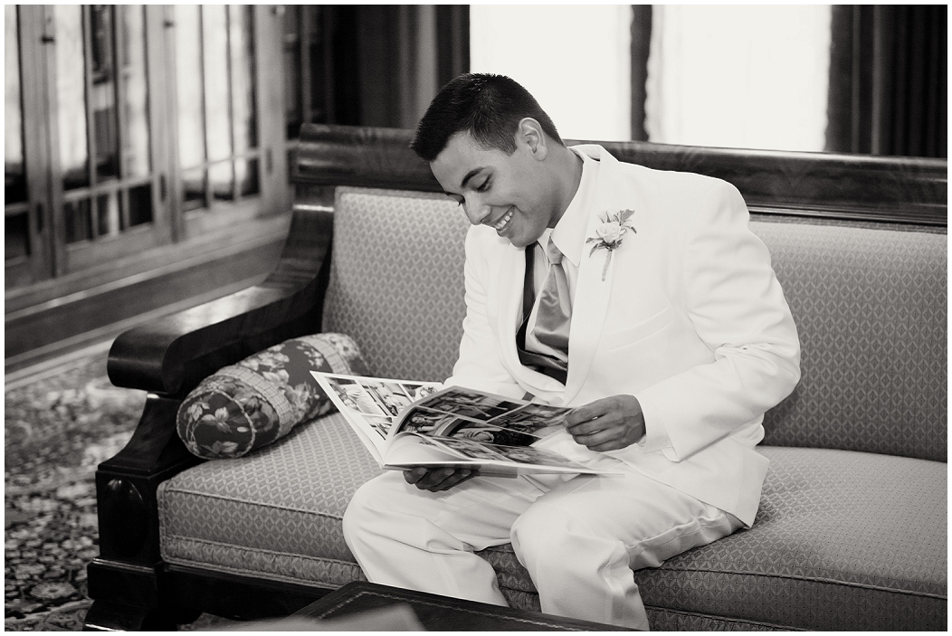 picture of groom looking at boudoir book