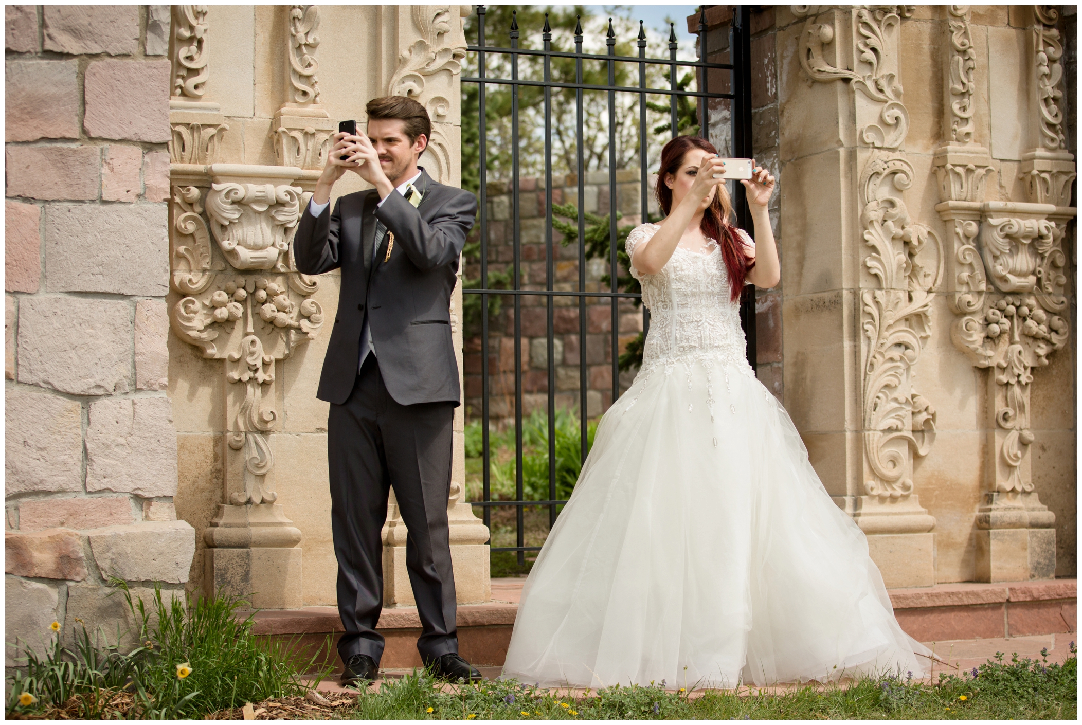 picture of bride and groom taking selfies 