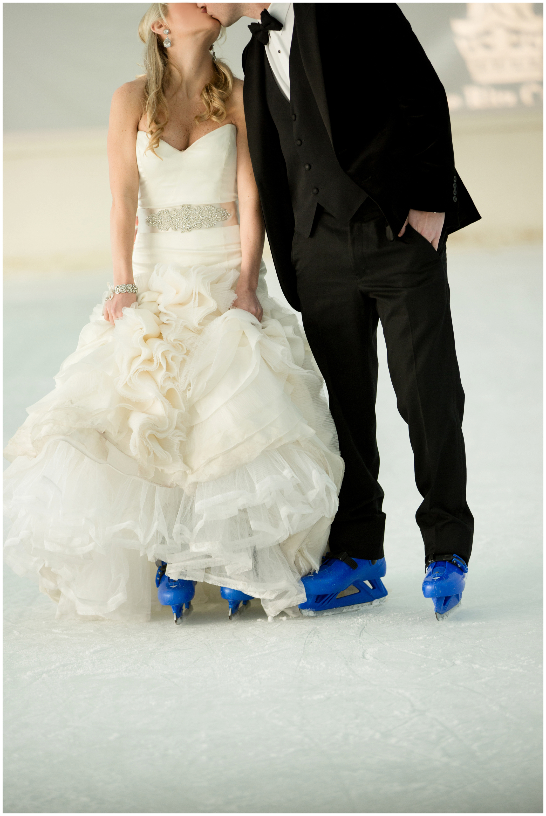 picture of bride and groom ice skating 