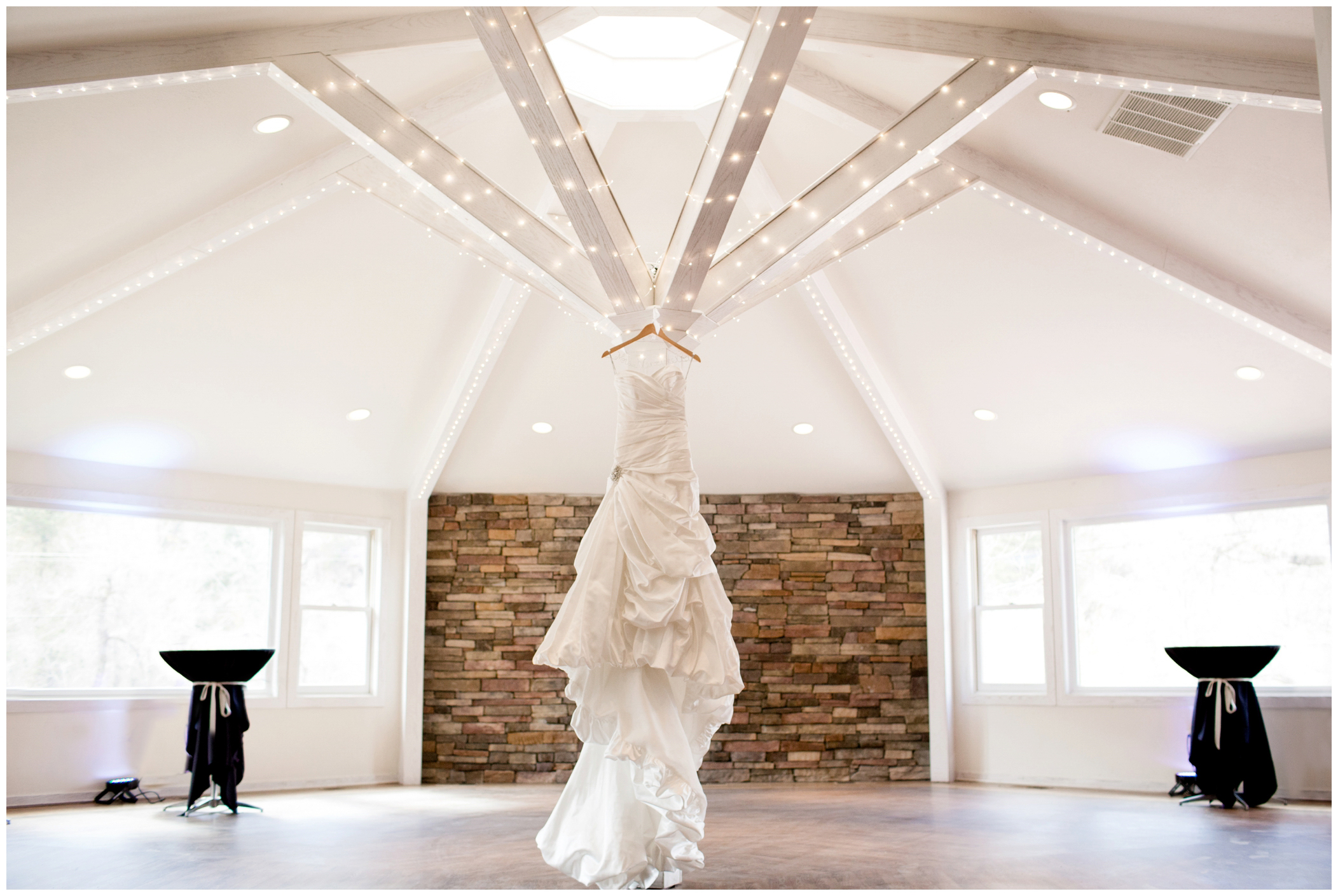 picture of wedding dress hanging from ceiling