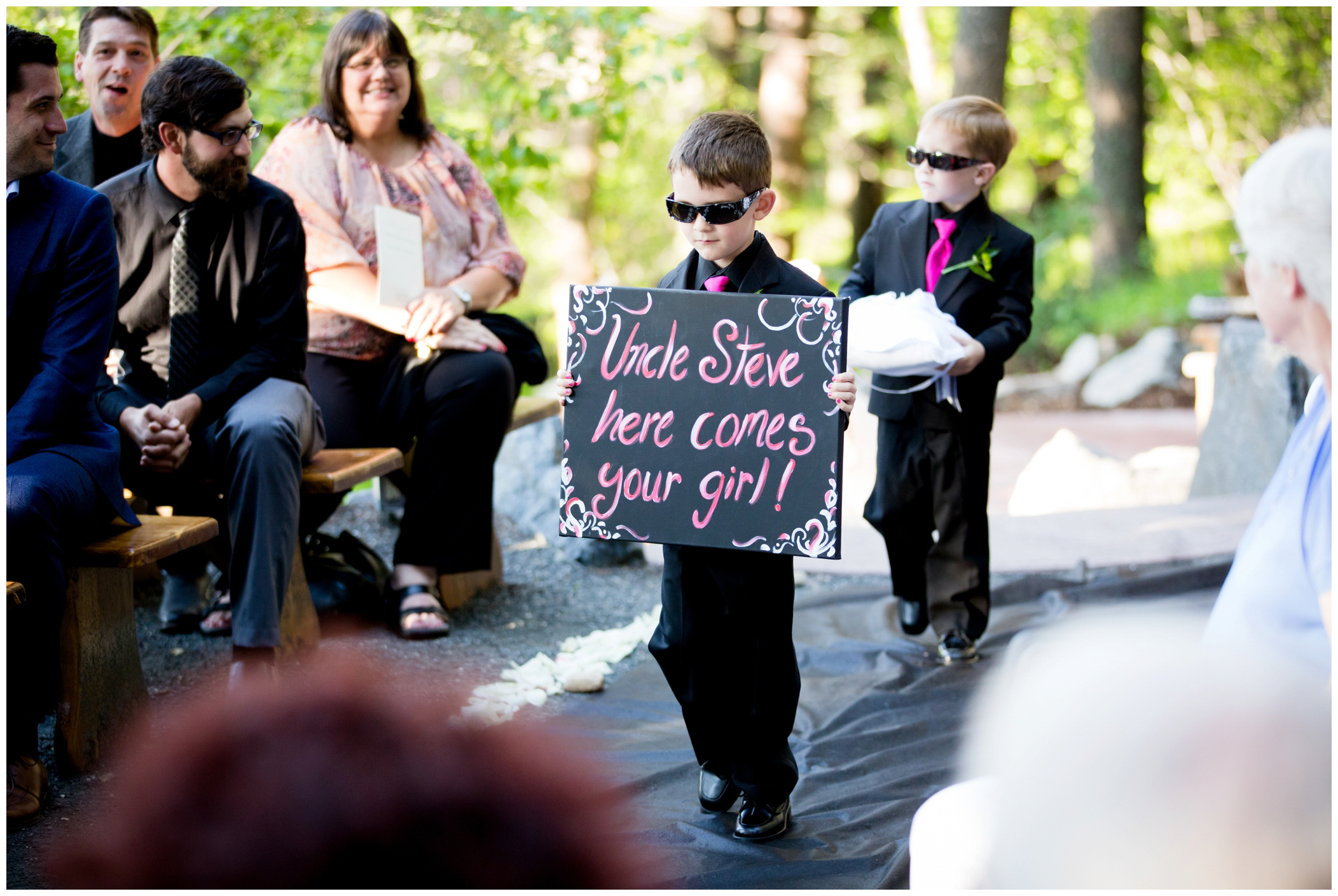 picture of ring bearer carrying sign 
