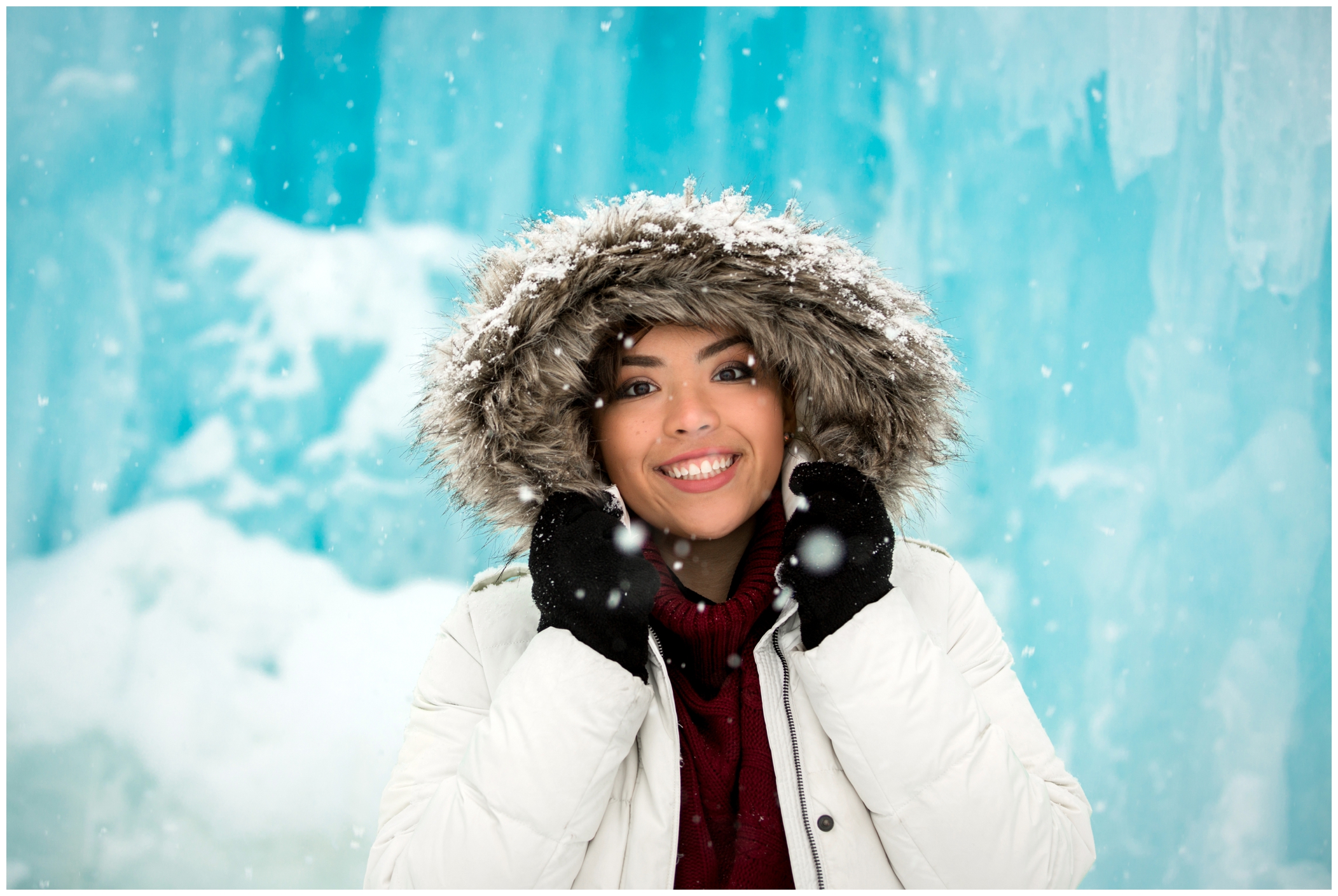 Colorado winter senior photos with a girl wearing a fur-lined coat 