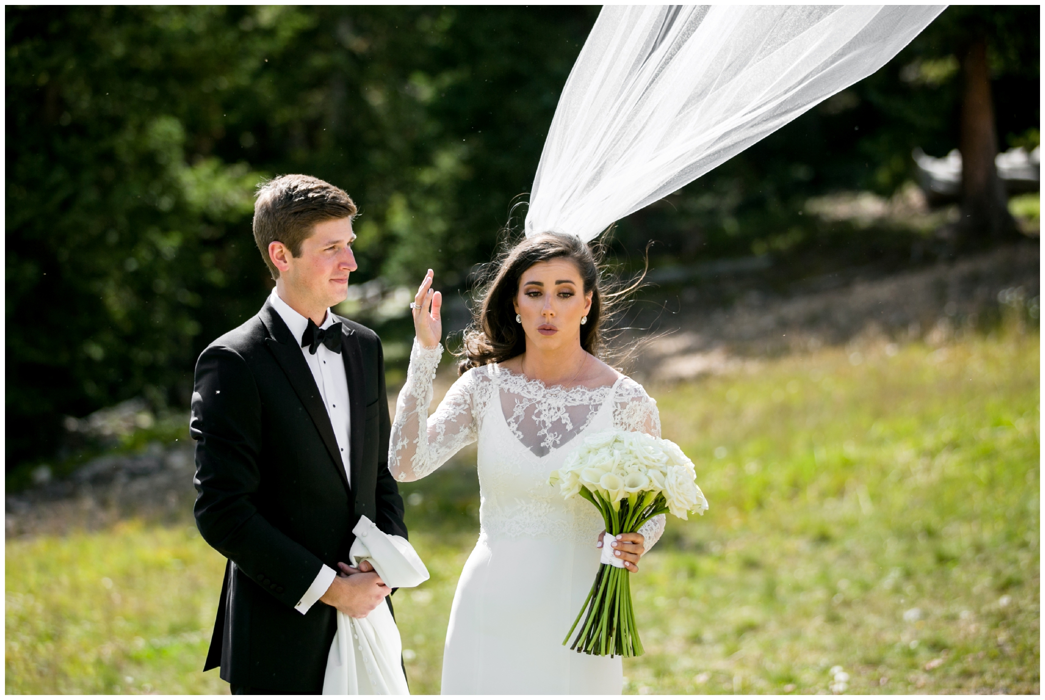 wind blowing veil during Colorado wedding bloopers