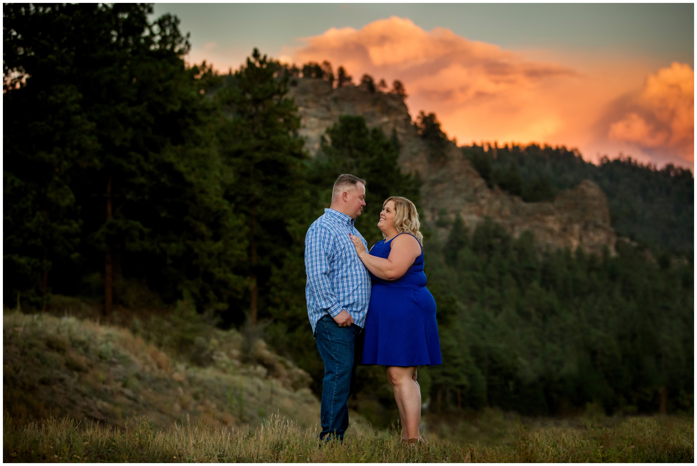 Bailey Colorado engagement pictures with mountains and colorful sunset in background