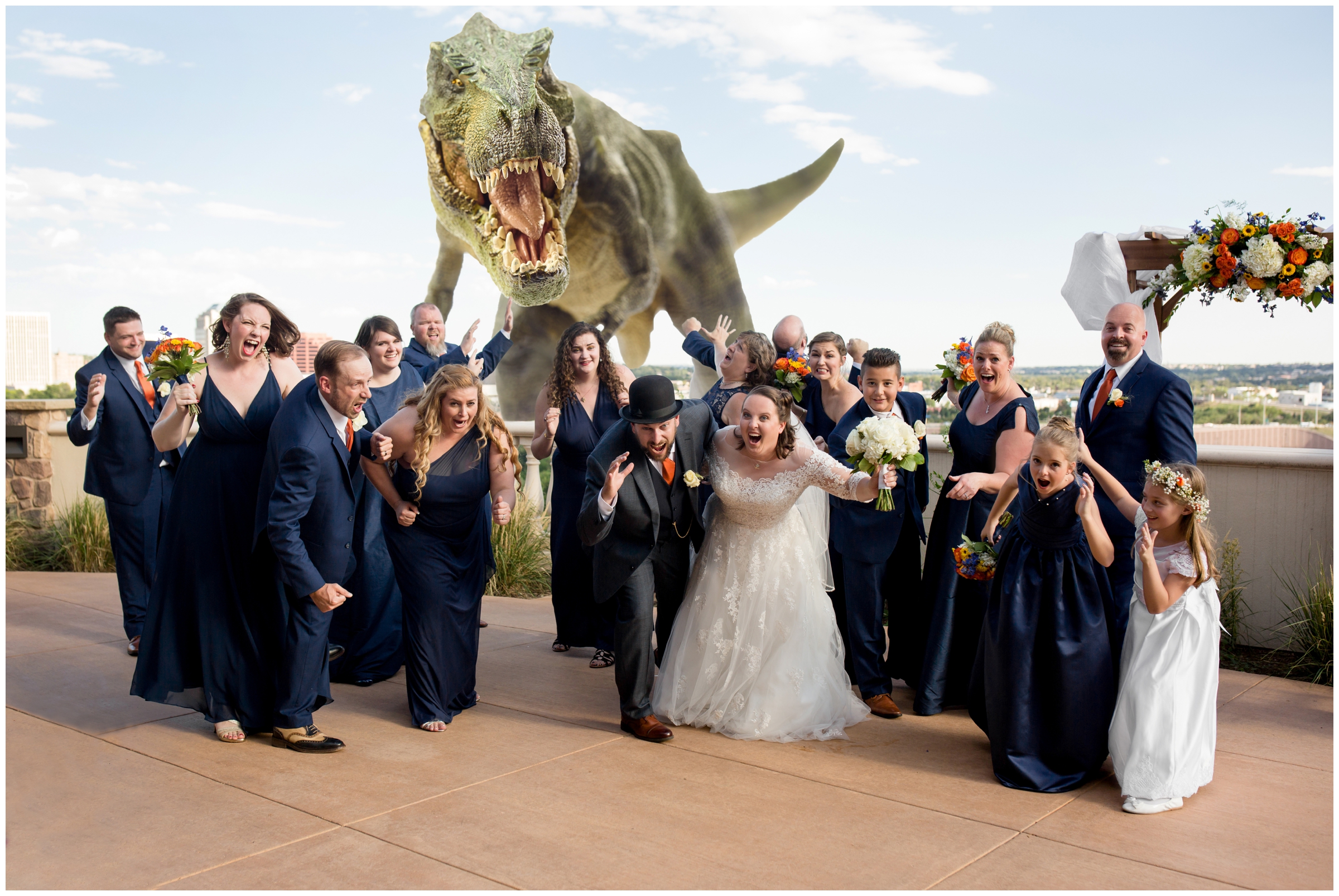 bridal party running away dinosaur during Colorado Springs wedding 